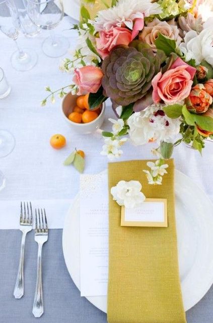 23-a-neutral-tablescape-with-a-bold-floral-centerpiece-and-a-mustard-napkin.jpg