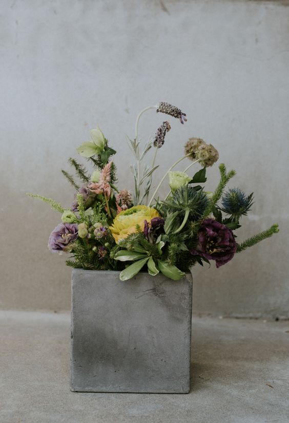 02-a-concrete-box-with-greenery-and-blooms-for-a-modern-wedding-centerpiece.jpg