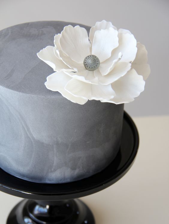 35-textural-concrete-wedding-cake-with-a-large-white-flower.jpg