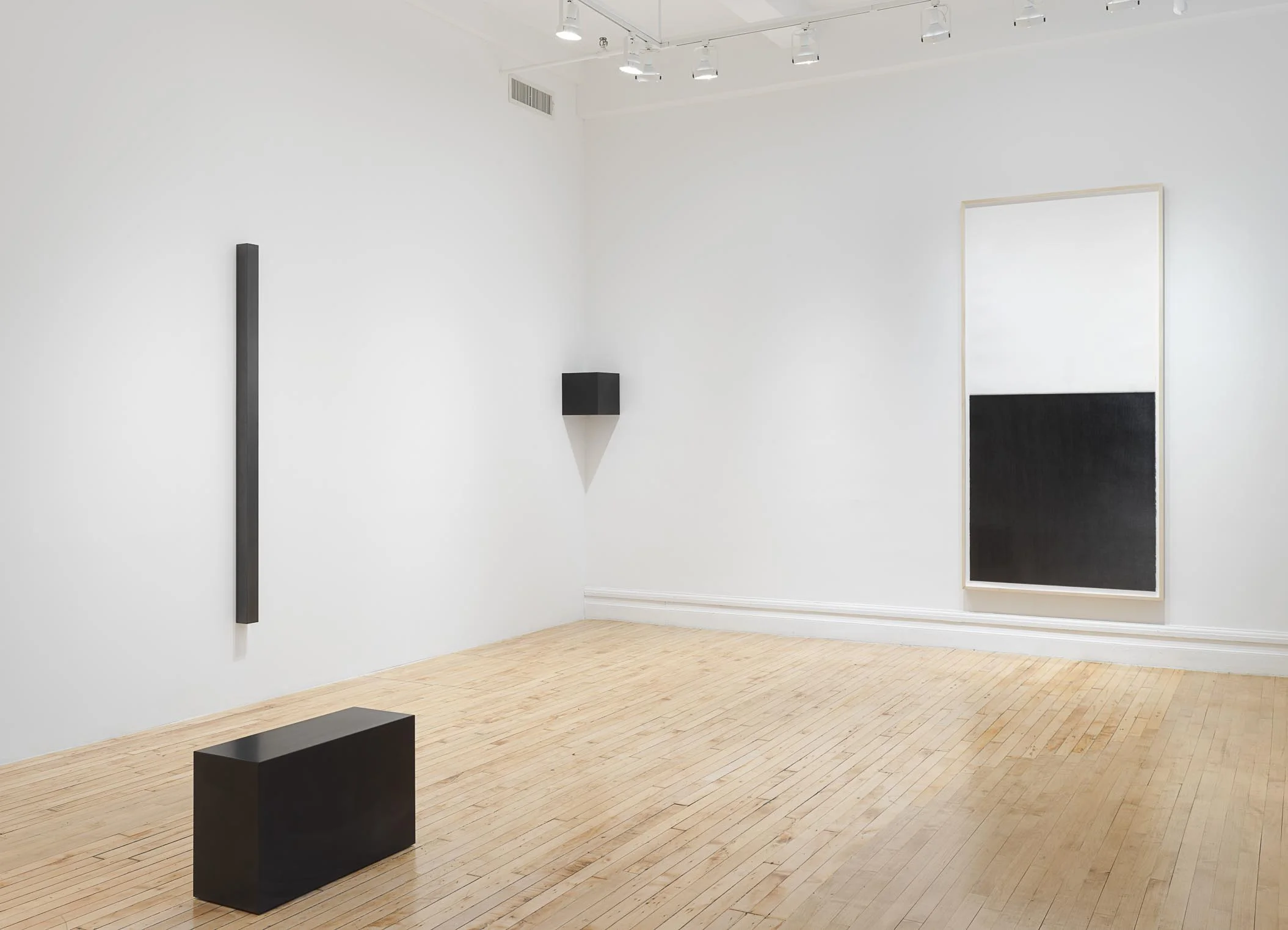 Installation of Susan York’s New and Recent Worki at the gallery. Includes geometric sculptures in graphite as well as a drawing.