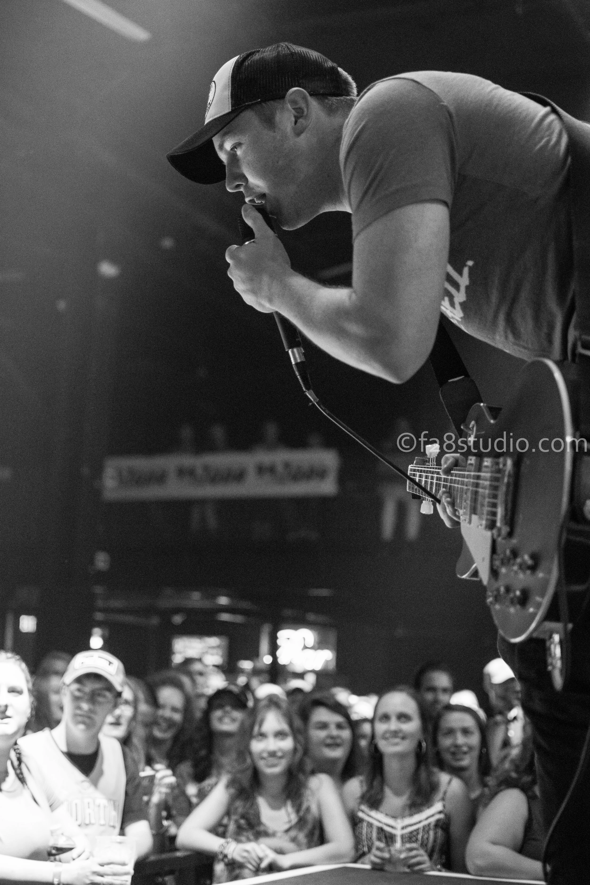 Travis Denning singing to the crowd
