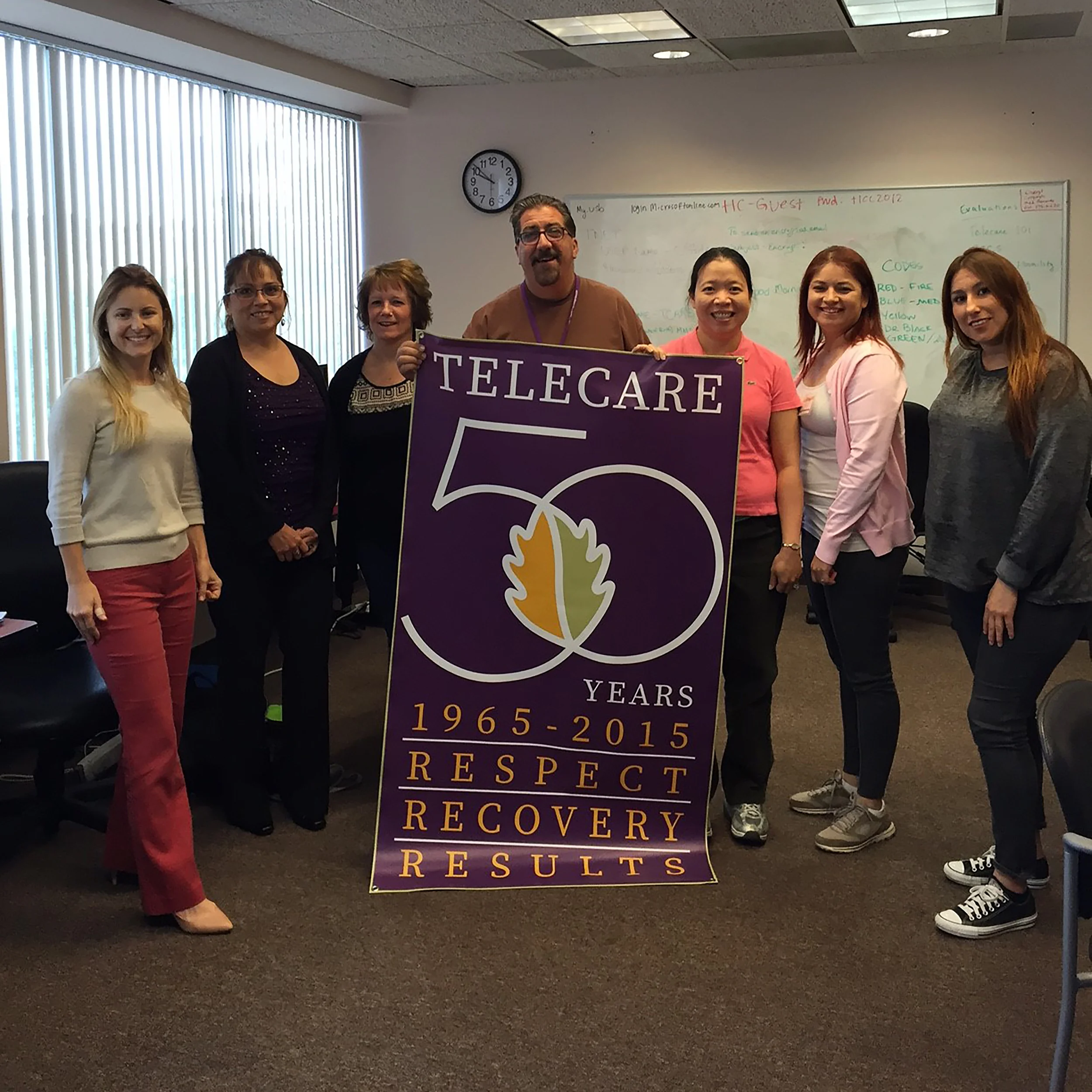 (L-R) Natalie D. Blair , Program Administrator; Zenaida "Zee" Vega , Receptionist; Christine "Dee Dee" Ortego , PSC 3; Scott Jackson , PSC 3; Jane Sia-Flaherty , MHRS; Sandra Tello , PSC 2; Amy Siez , Peer Support Specialist