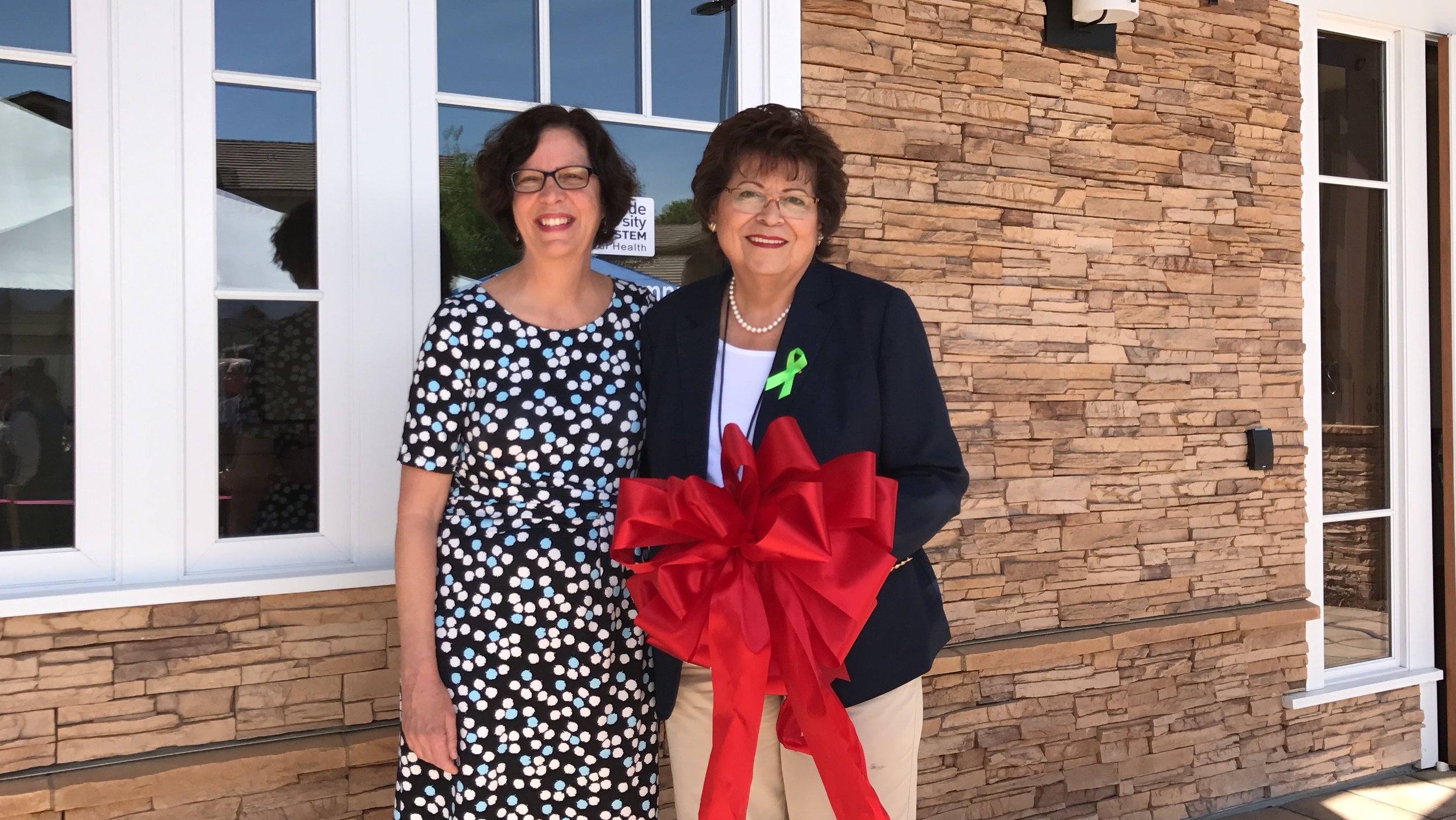  Faith Richie, SVP of Development, and Maria Marques, Deputy Director at Riverside University Health System-Behavioral Healthat the Lagos ribbon cutting ceremony and open house on May 3. 