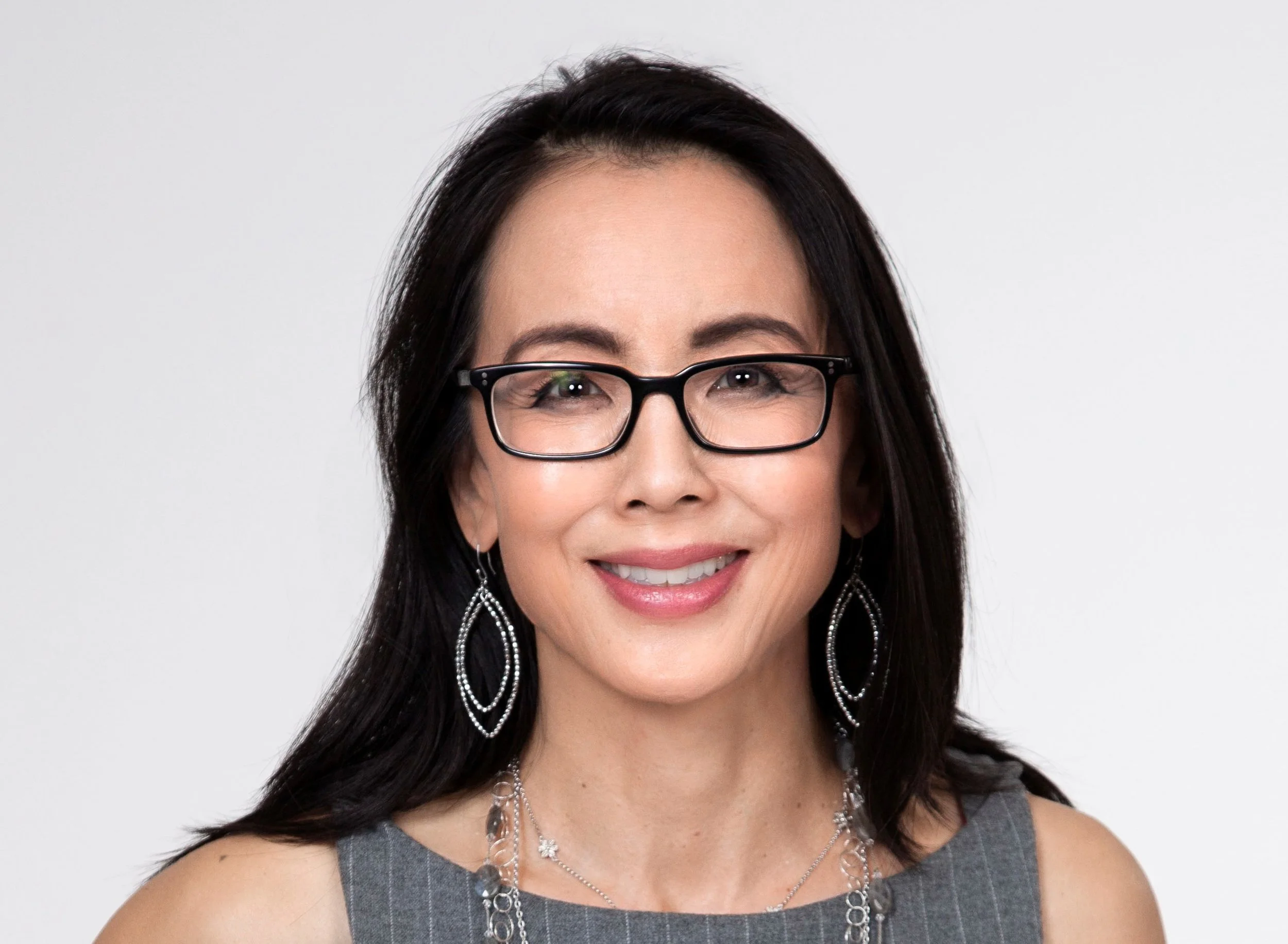 shc 2018 headshot gray dress black glasses.jpg