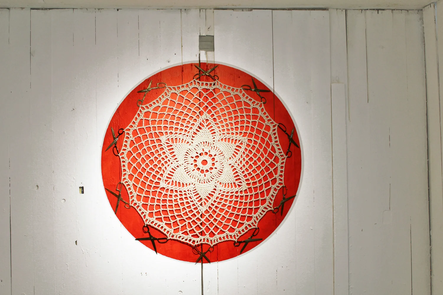 The doily is a common decorative item that serves to physically protect domestic articles. Its circular form, often containing a star motif, echoes the hex sign as well as the magical circle.