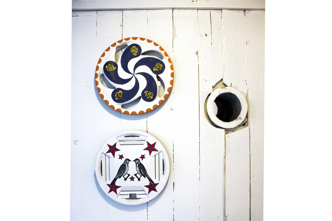 TEX HEXES painted on hub cabs include classic symbols of Texas -- the longhorn, yellow rose and mockingbird.