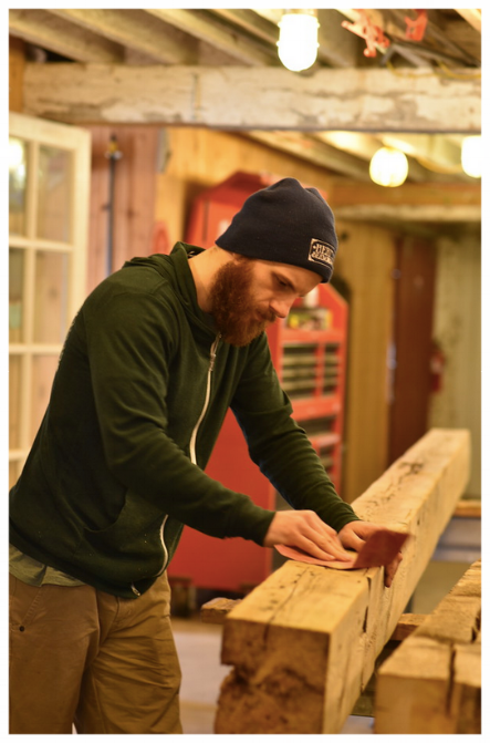 Kalen hand-sanding a beam. That's gonna take a while.