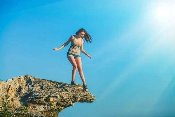facing fear on the edge of a cliff