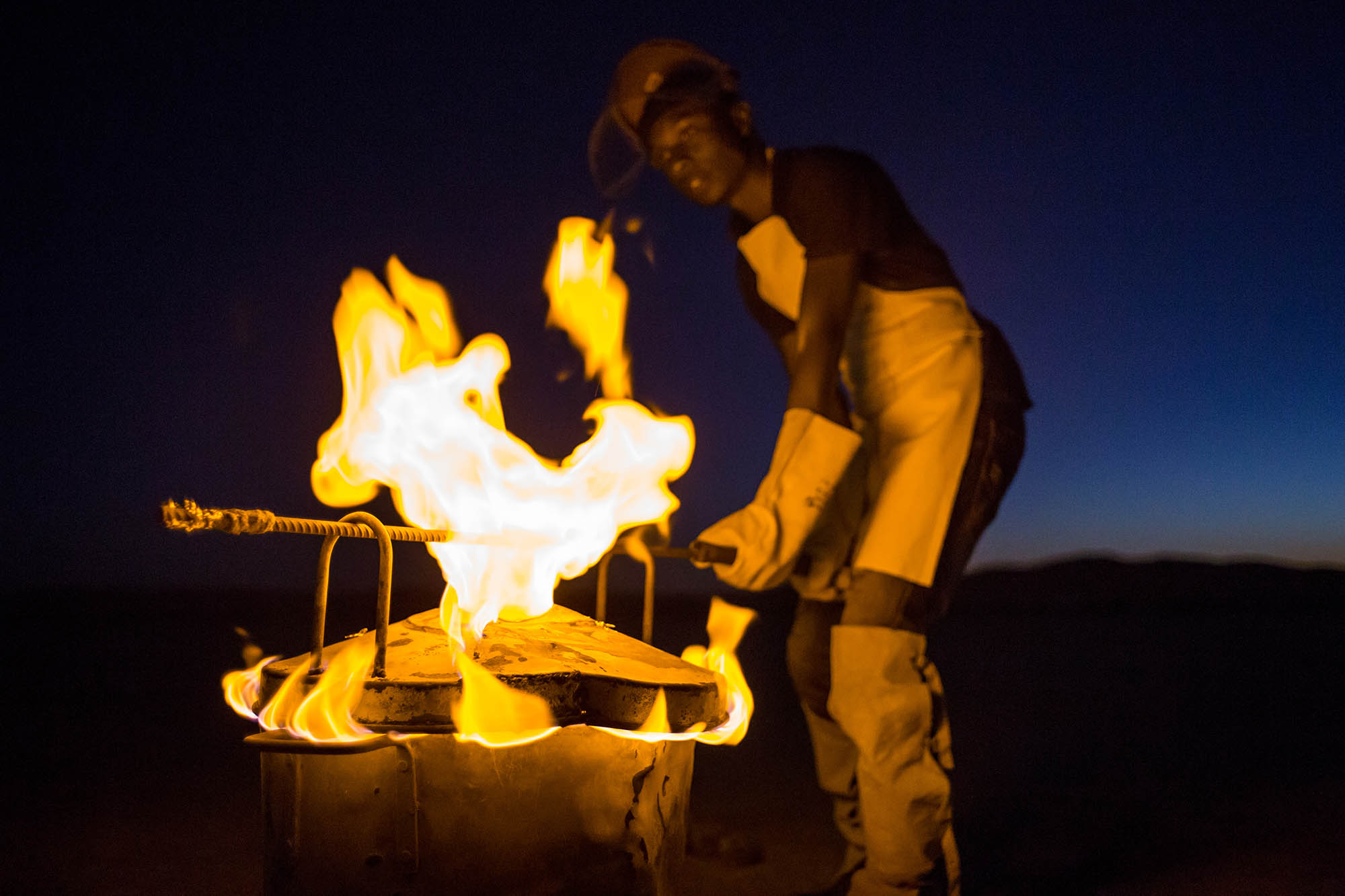 Above: Martin prepares to remove the lid to extract the melted zinc.
