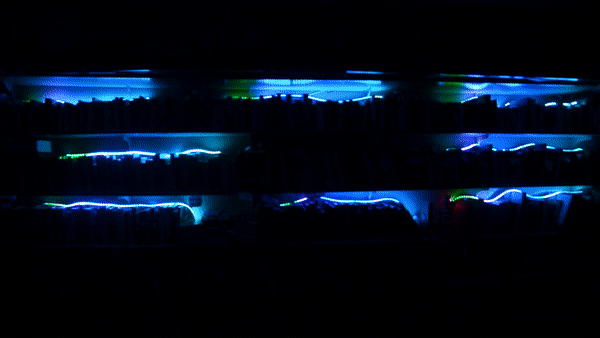 Mesh-networked wireless lighting controllers sync lighting animations together as they come in and out of range of each other. IR remotes toggle cues on the network. Each unit can power up to 10m of LEDs, with a mobile battery pack or wired power. Piezo sensors connect to a signal conditioning circuit to trigger animations based on nearby vibrations.