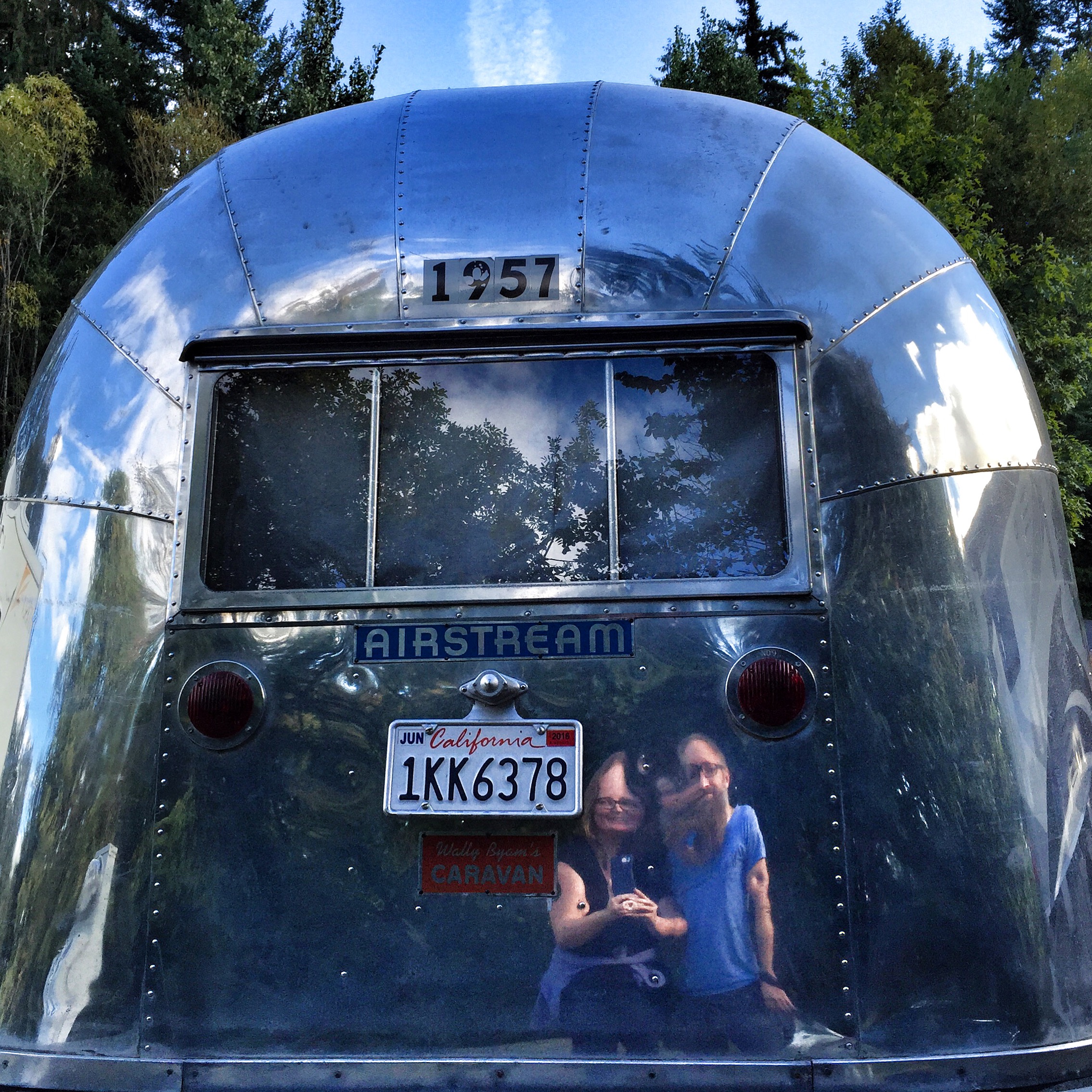 Fun house mirror reflection in vintage airstream