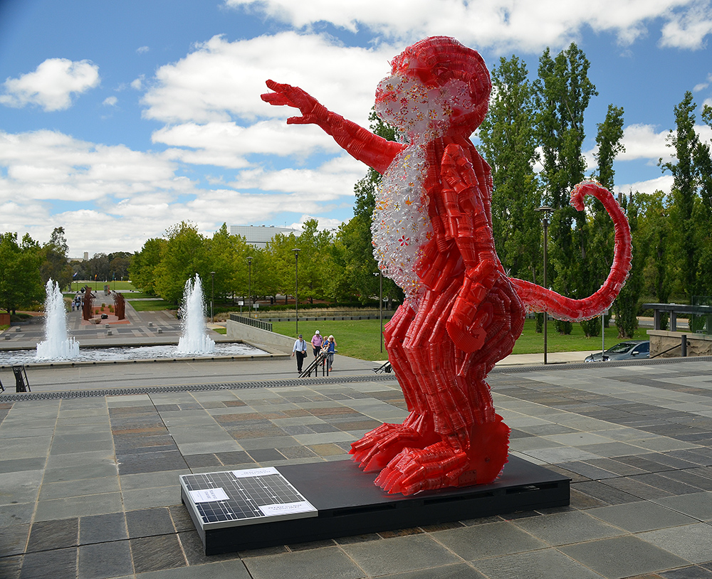 A monkey in front of the library made out of recycled plastic because ART. Powered by a solar cell, it evidently lights up at night. Didn't see that.