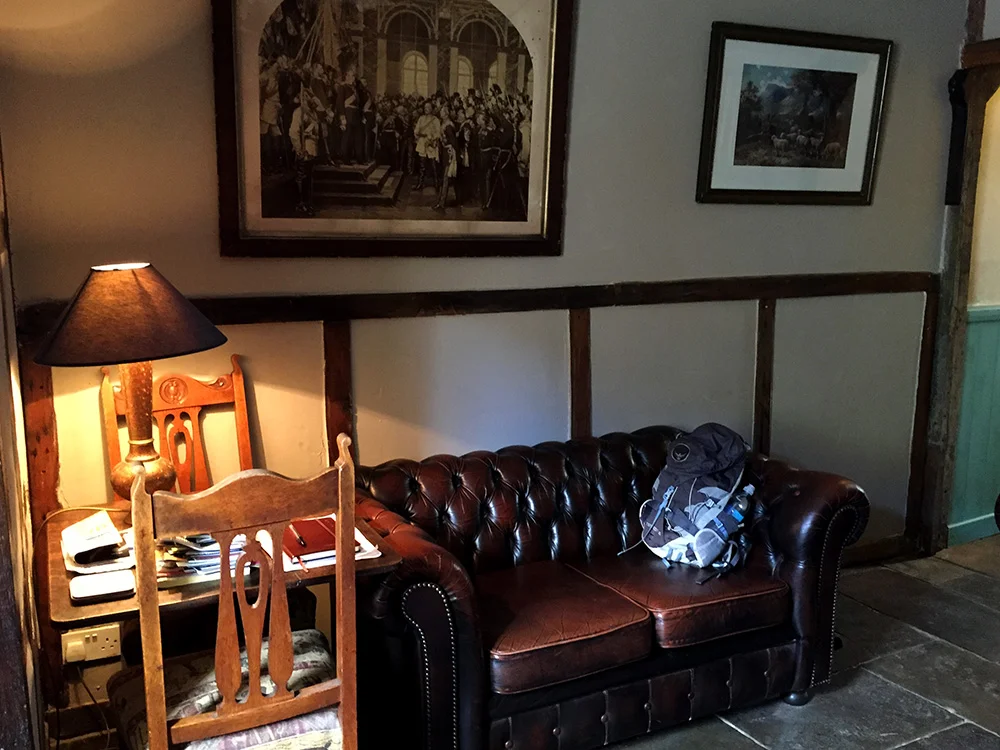 Stone floors and etchings of British people doing British things decorated the house.