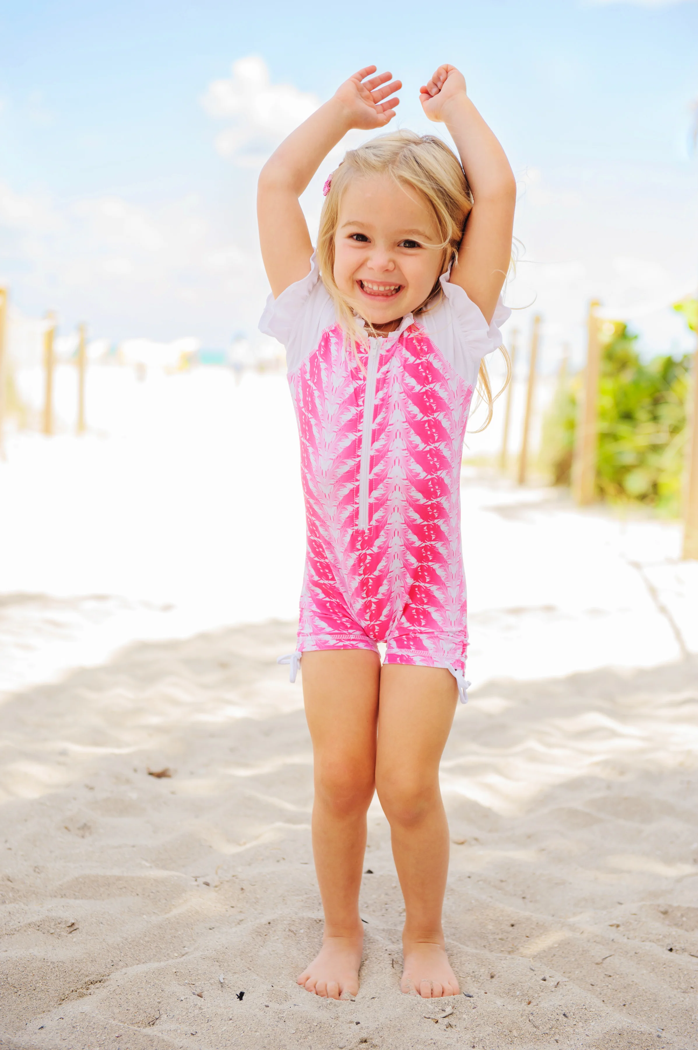 FUSHIA FEATHERS SUNSUIT.jpg