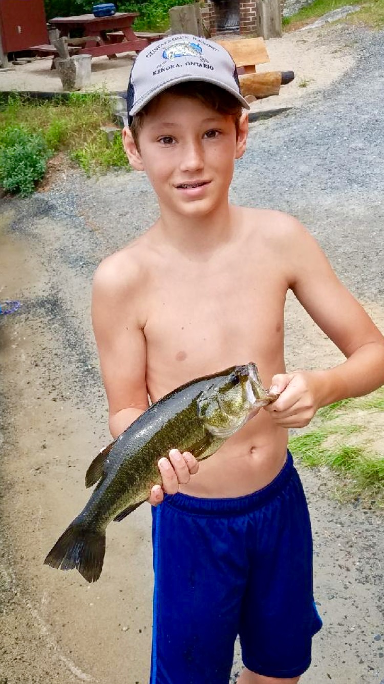 Little Kid Reels In An Absolute Hog Of A Bass In Wholesome Video