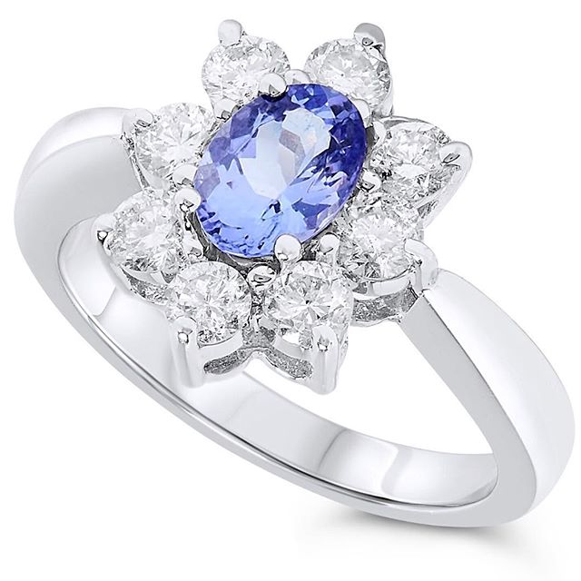 Tanzanite with a large diamond halo. #tanzanite #rings #luxury #jewelrypie