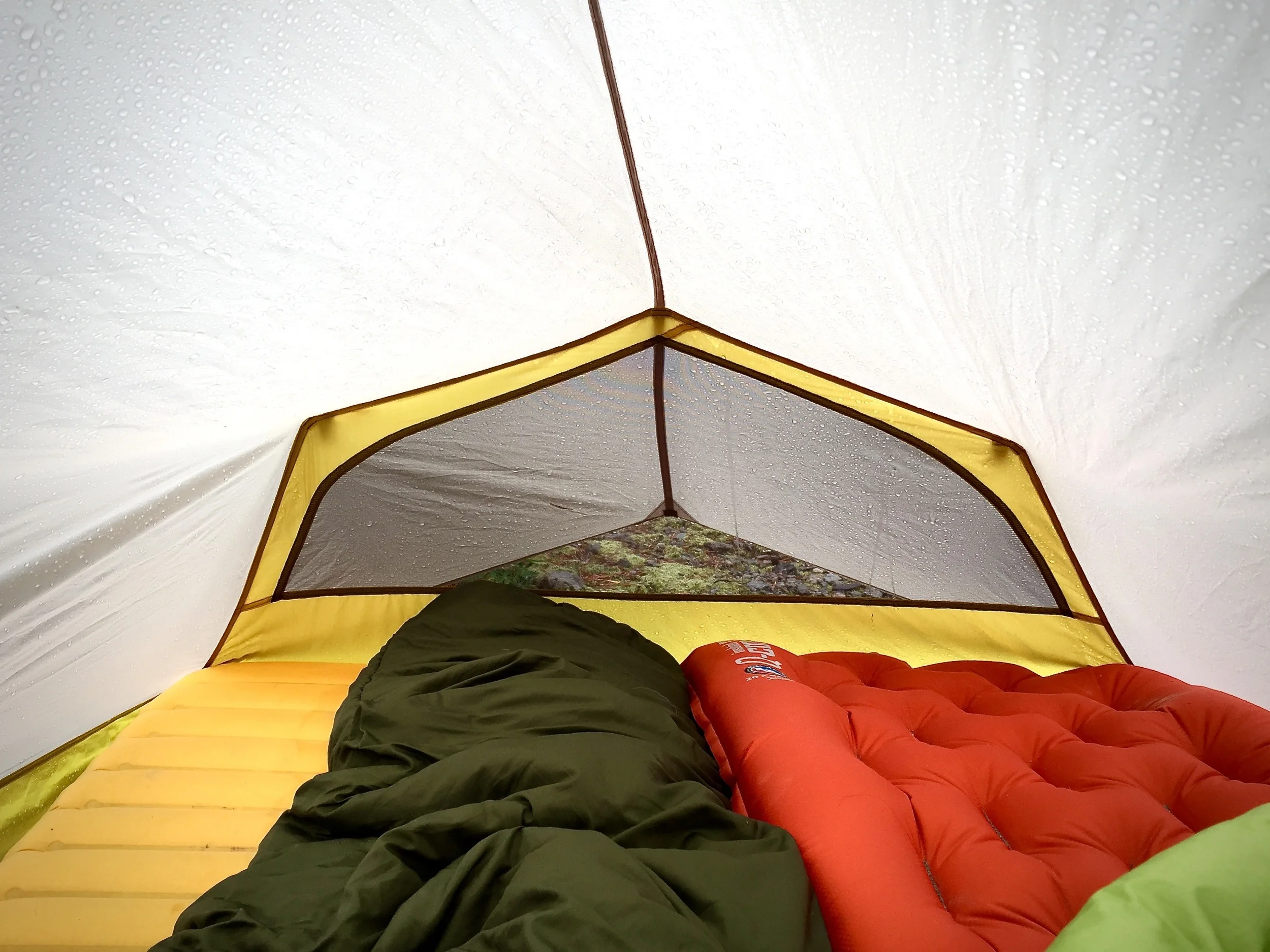 The Lightning 2 FL is roomy for one average sized backpacker and livable for two. The back half of the tent body is a single layer which means there is no secondary barrier between you and the outside. At times this means you may experience some condensation but by ventilating properly, it can certainly be avoided or significantly reduced. If enough condensation accumulates, it can have a tendency to drip down and land on a sleeping back or pad but it's rarely enough to cause much concern. 