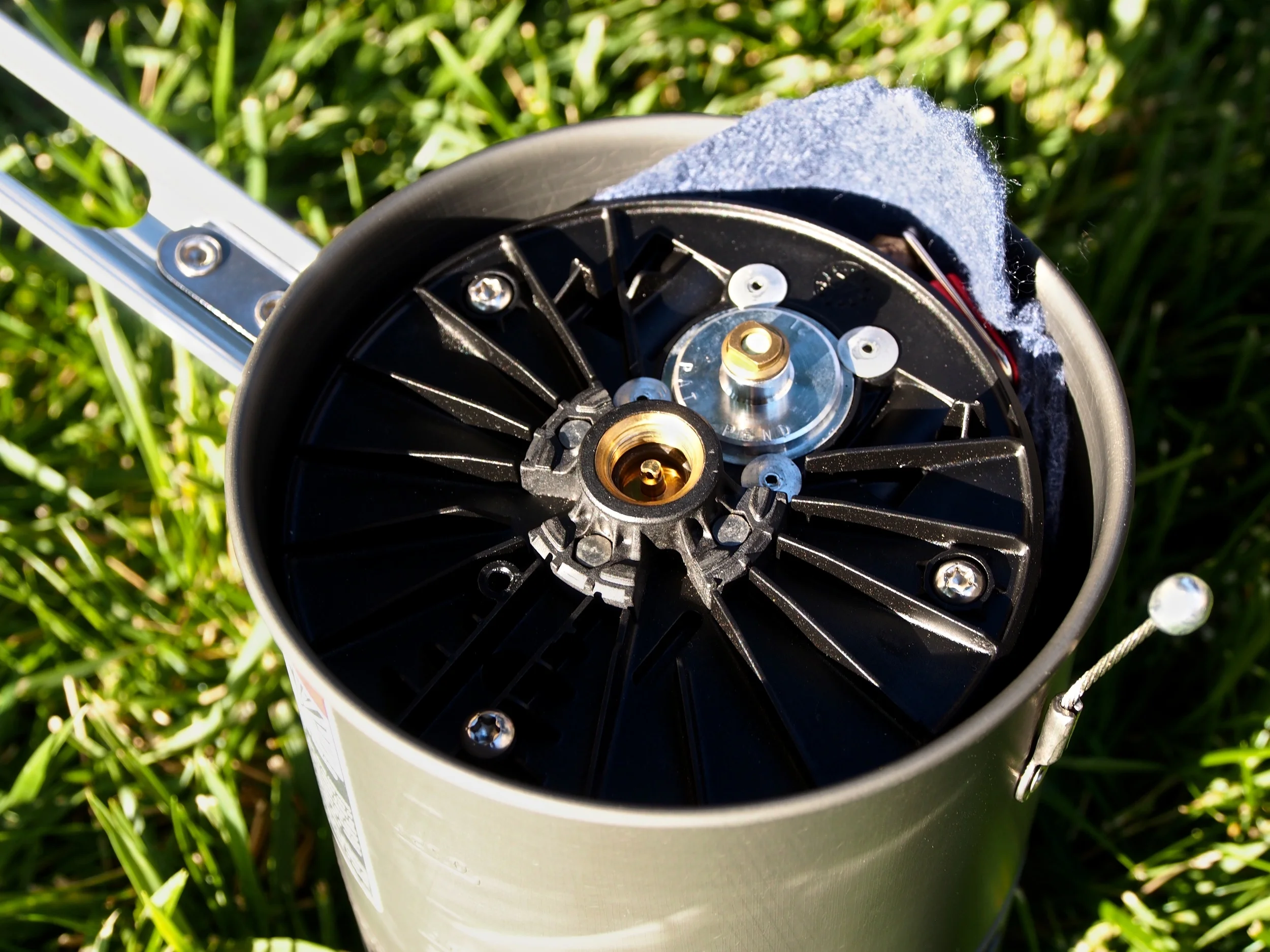 All stove components fit nicely inside the pot. This includes the fuel canister and burner. Pictured here is a piece of cloth that I use to line the pot in order to protect it from the contents when it's packed away. I can also fit a small lighter inside as well since the stove does not have any sort of ignition system. 