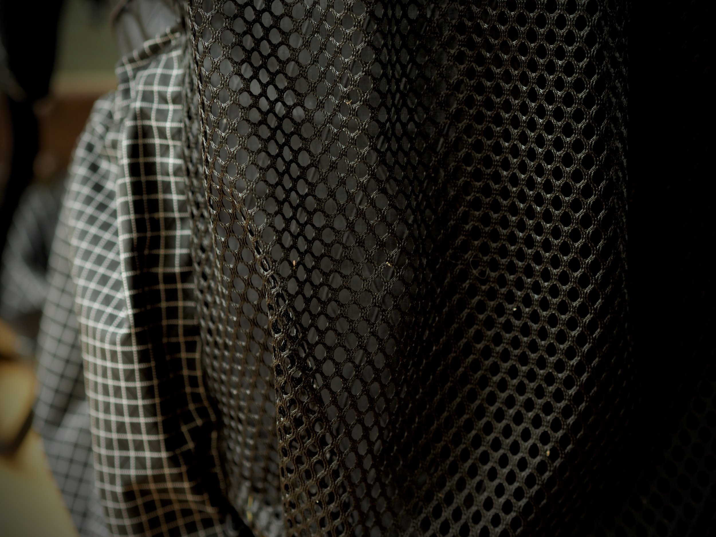Mesh versus stretch fabric. Far better durability.