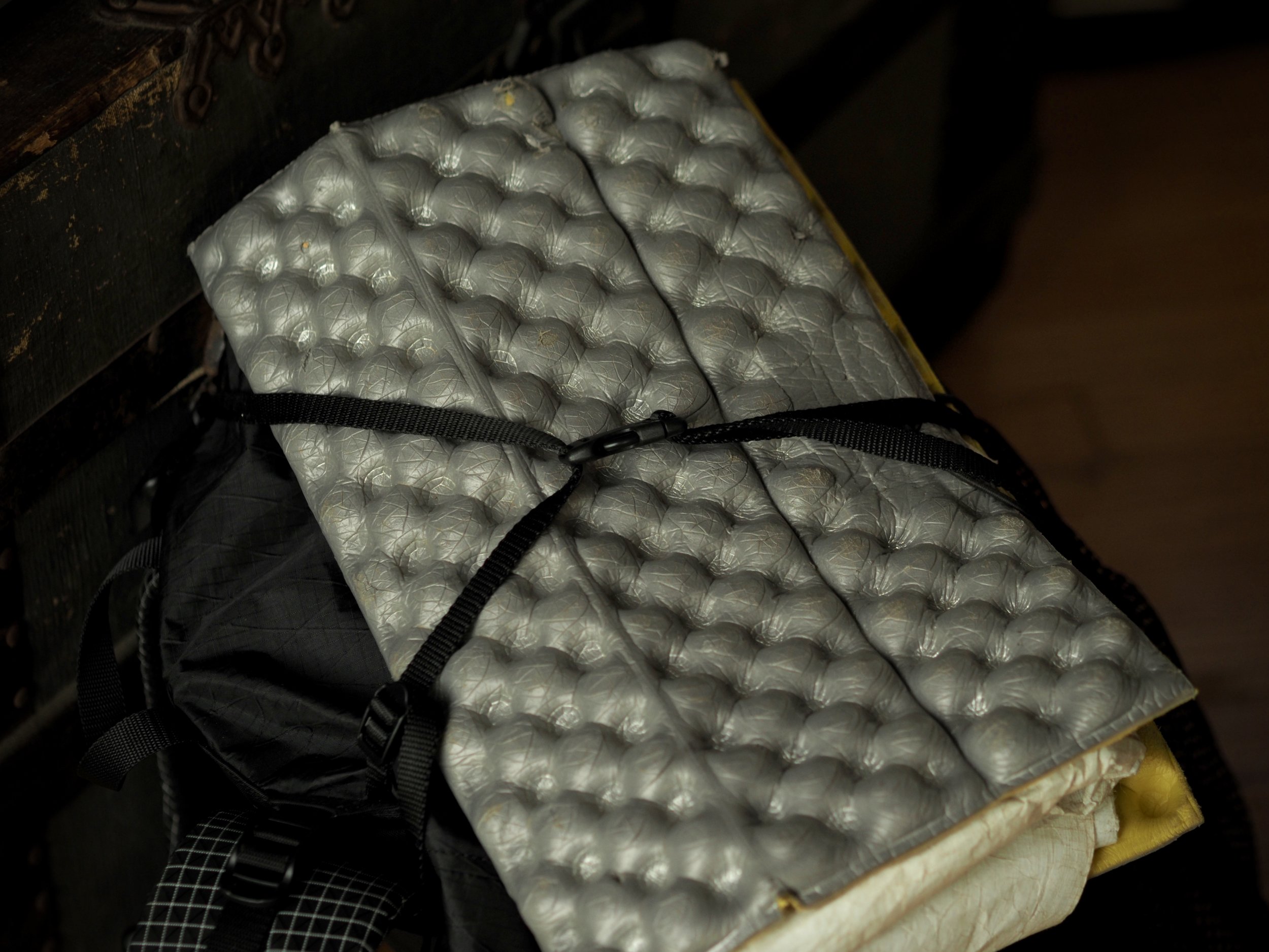 Over the top compression straps for attaching things such as a seat pad.
