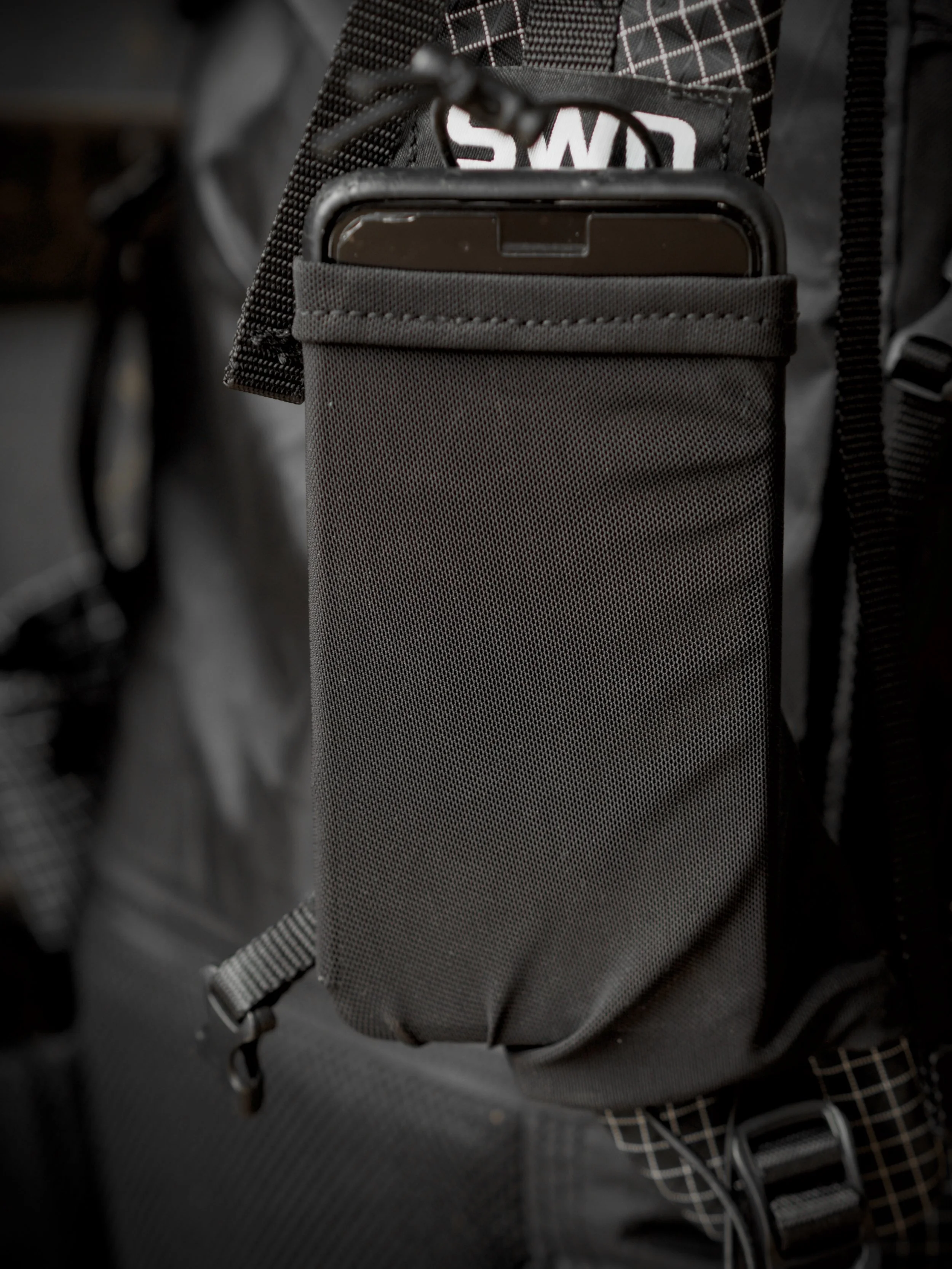 iphone 7plus fits in the shoulder pockets.