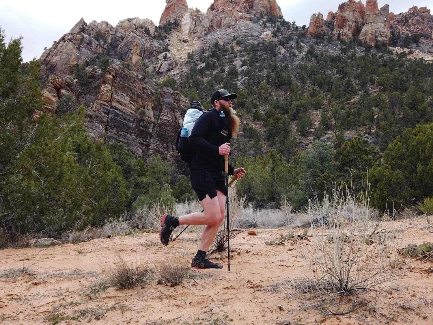 Tayson Whittaker fastpacking in mountain terrain