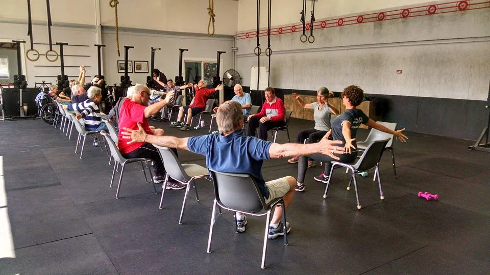 Sarah leading a Parkinson's group fitness class for Austin’s local non-profit, Power for Parkinson’s, with seated PWR!Moves.