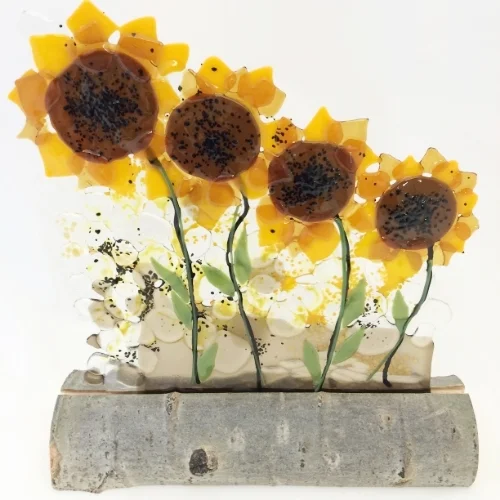 sunflowers in aspen log stand