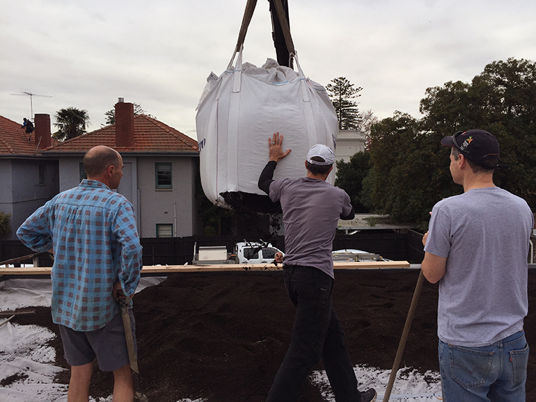 Craning the soil in to place