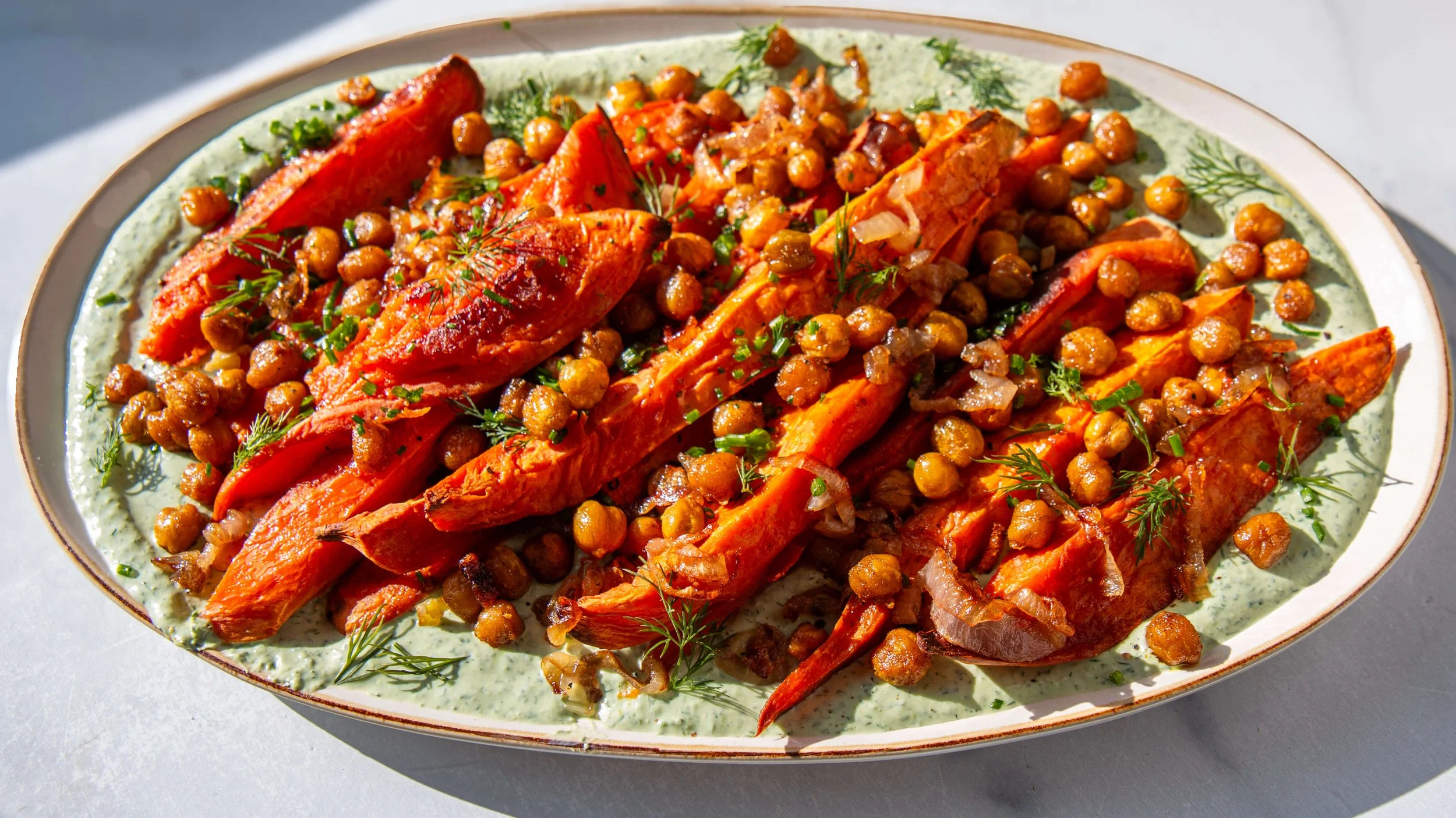 Roasted Sweet Potatoes with Herbed Yogurt, Crispy Shallots, and Curry- Spiced Chickpeas 
