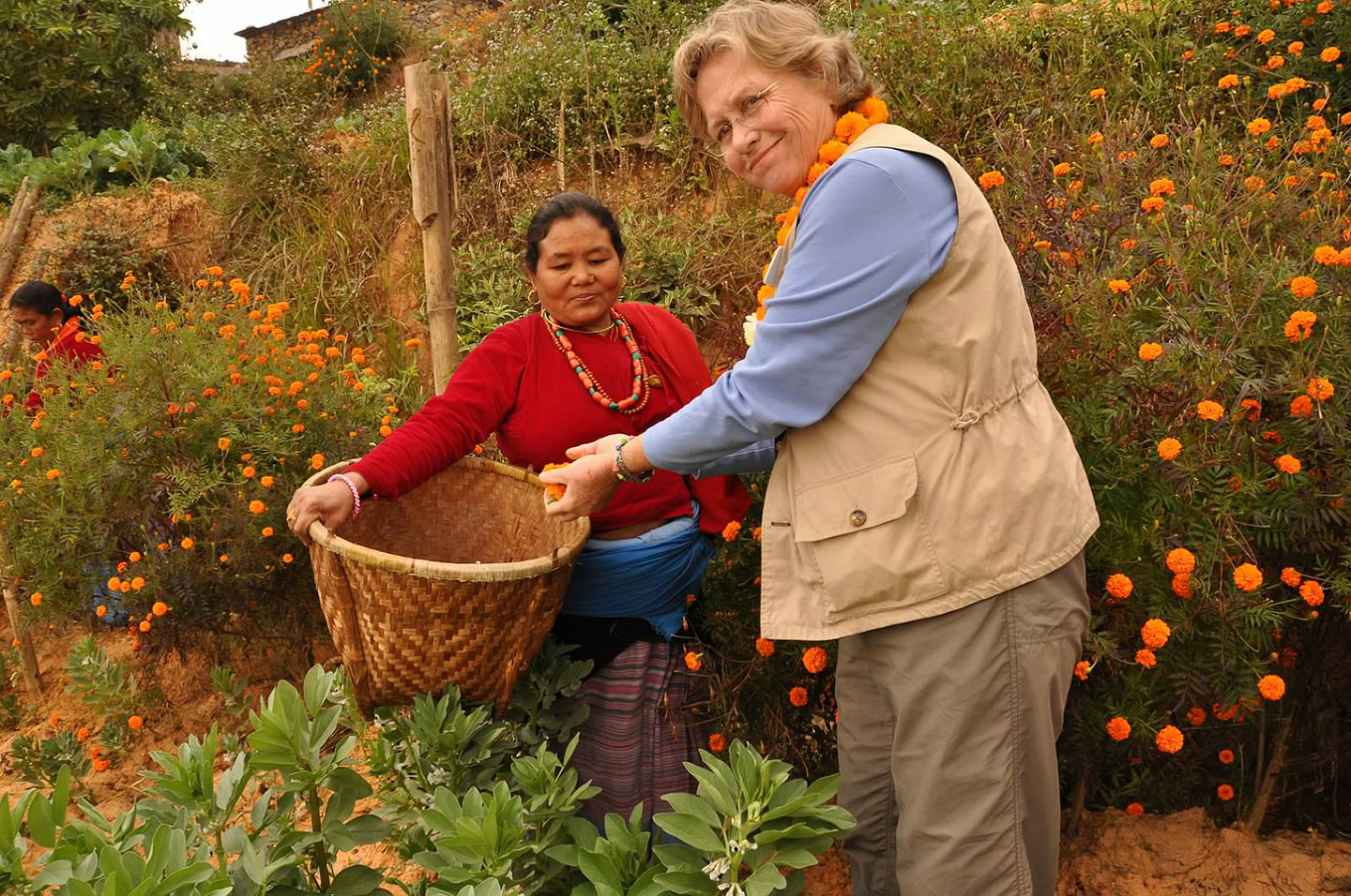 2_Nancy adds her marigolds to the community.jpg