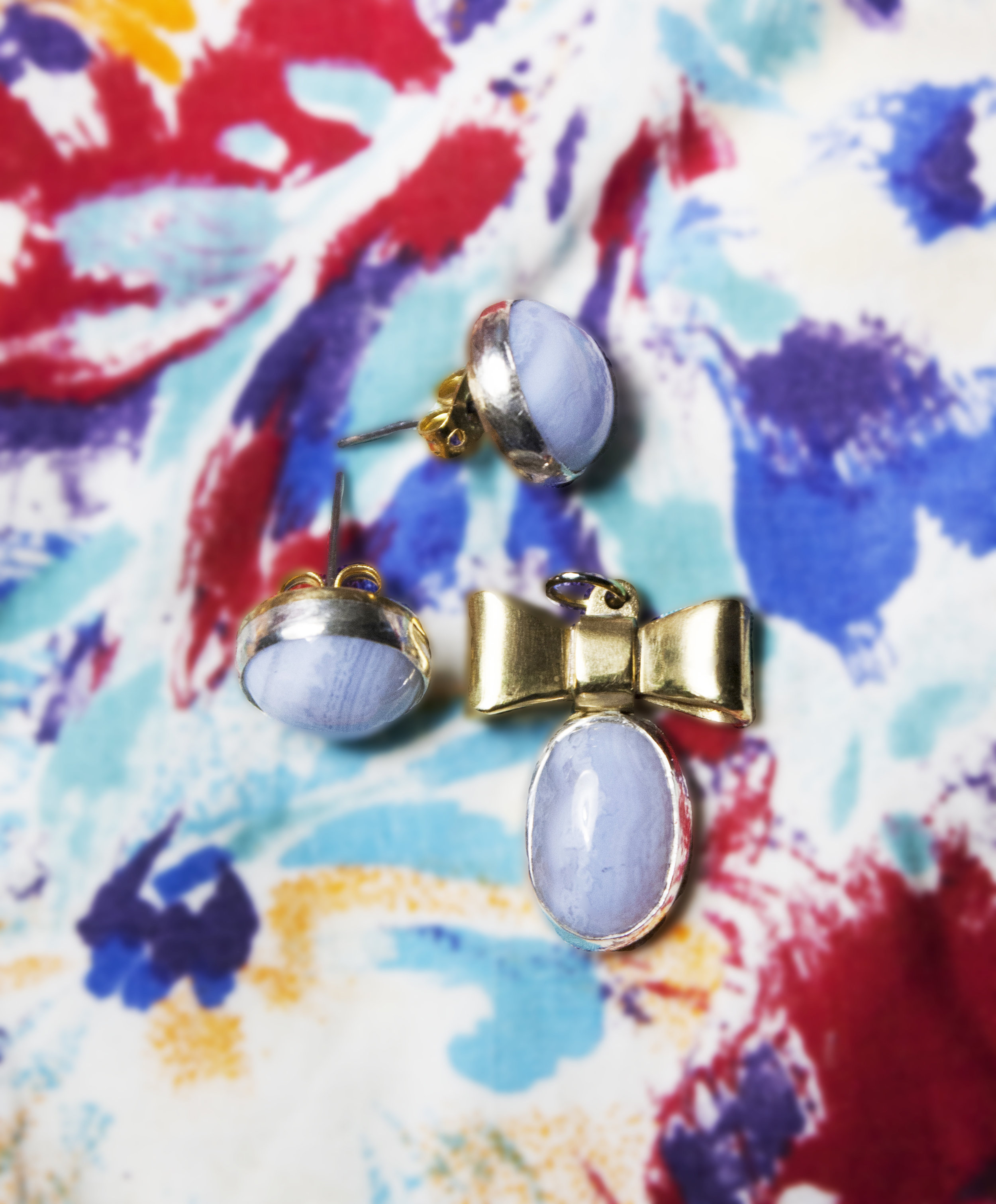 stone set earrings and necklace pendant. hand drawn, hand cut, soldered, set, and polished.