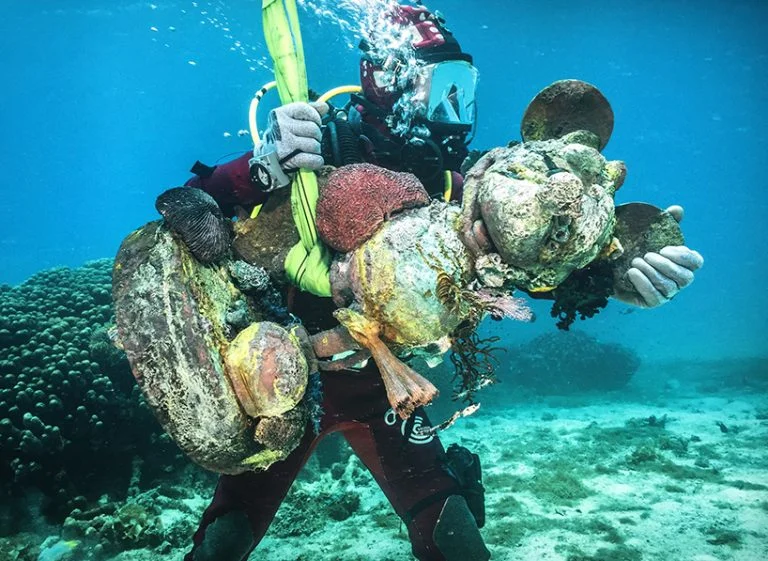 Treasures from the Wreck of the Unbelievable, Palazzo Grassi| damien hirst, detail of mickey carried by diverunderwater photography by christoph gerigk