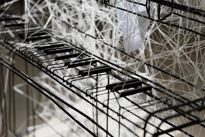 chiharu shiota, beyond time, 2018 | white thread, metal piano, musical notes © VG bild-kunst, bonn, 2018 and the artist, courtesy yorkshire sculpture park | photo © jonty wilde