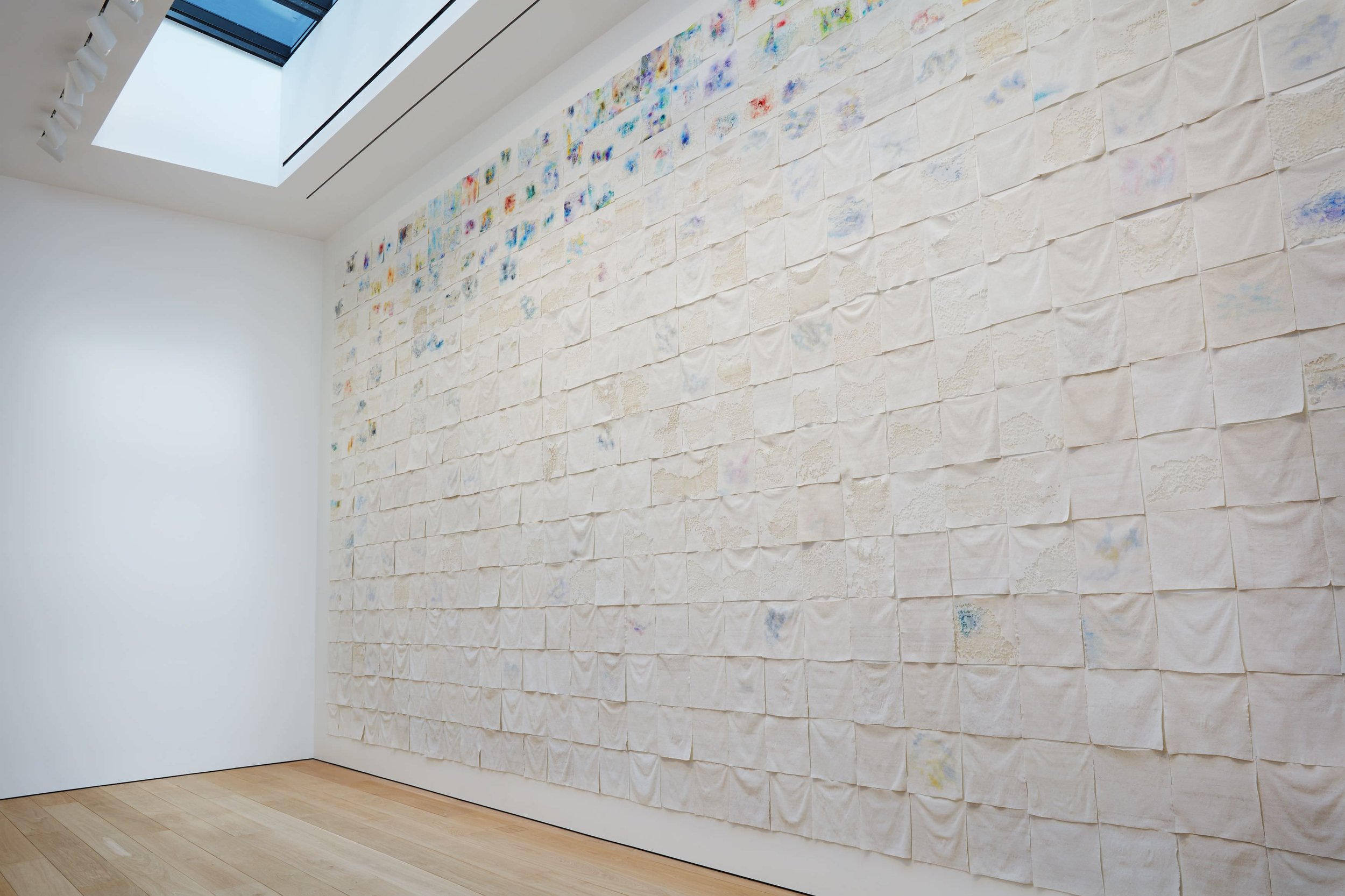 LIZA LOU The Clouds, 2015-2018 site-specific installation of oil paint on woven glass beads and thread on canvas 600 parts, each 35 x 35 cm; Courtesy the artist and Lehmann Maupin, New York, Hong Kong, and Seoul. Photo: Matthew Herrmann