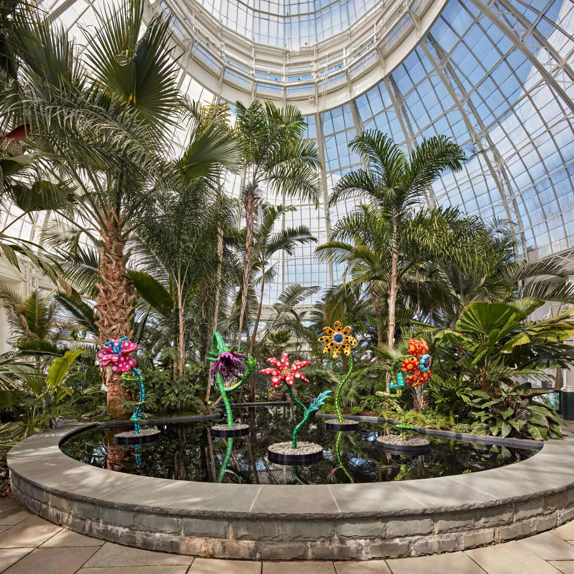 “My Soul Blooms Forever” (2019), view at the New York Botanical Garden, urethane paint on stainless steel, installation dimensions variable. Collection of the artist, courtesy of Ota Fine Arts, Victoria Miro, and David Zwirner.  Image via New York B…