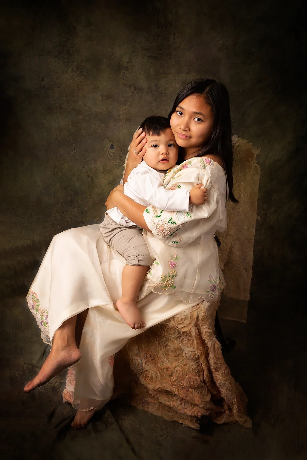 Mother holding her young child during a Mommy & Me studio photography session in Los Angeles.