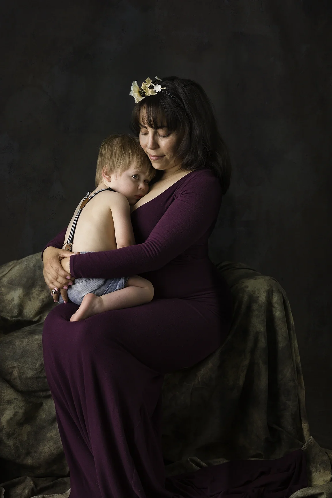 Mom holding and cuddling her toddler during a Mommy and Me photography session in Los Angeles.
