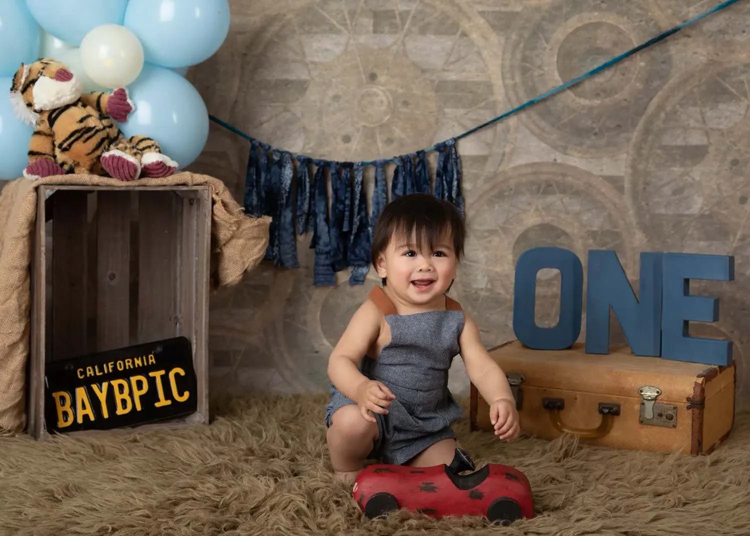 Baby boy celebrating his first birthday with a custom photoshoot in Glendale