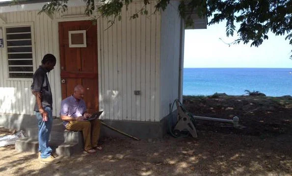 Will McClintock conducting an interview at Carr's Bay. Photo credit Robin Ramdeen.