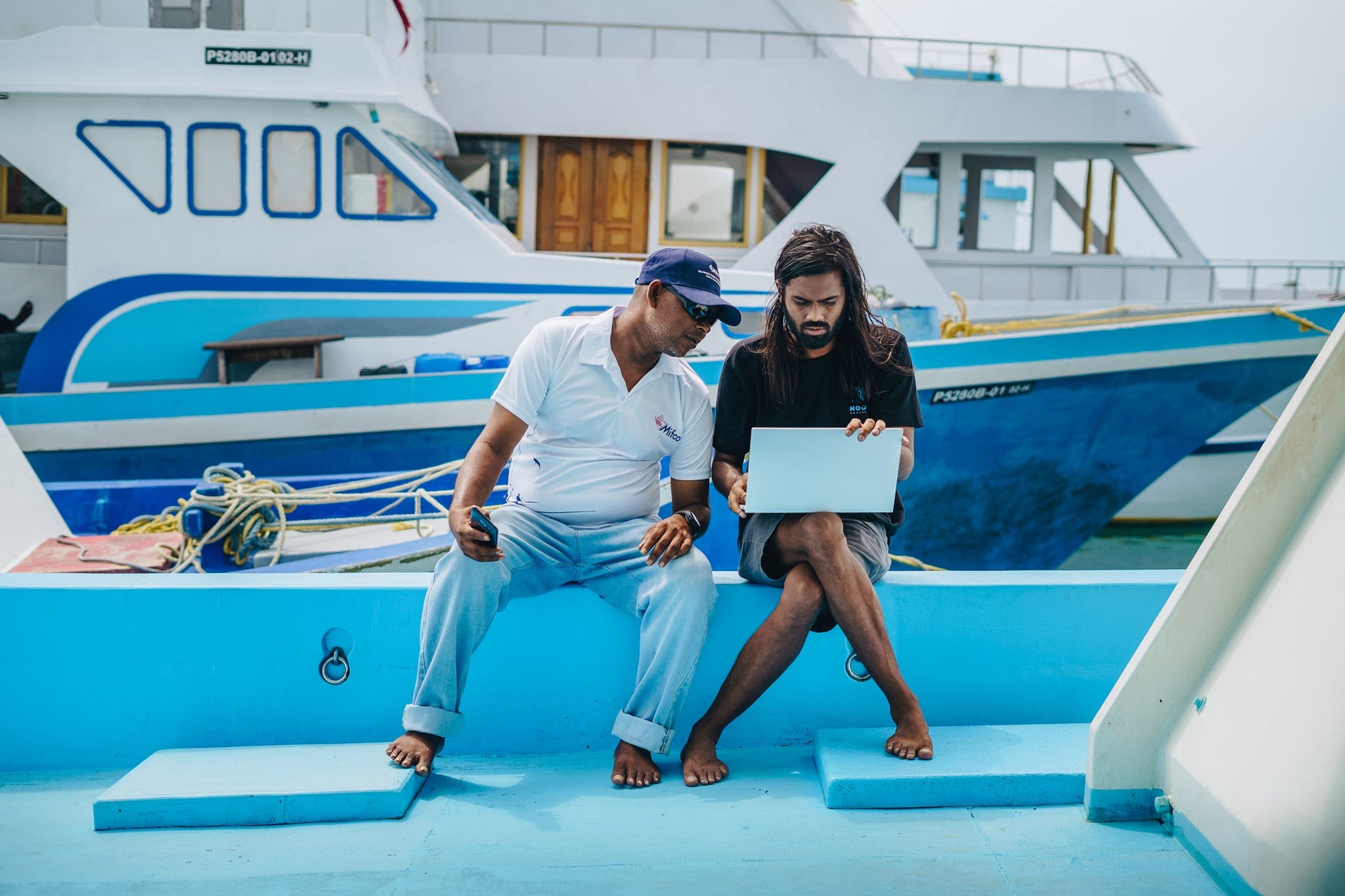 Maldives Two guys on Boat.jpg