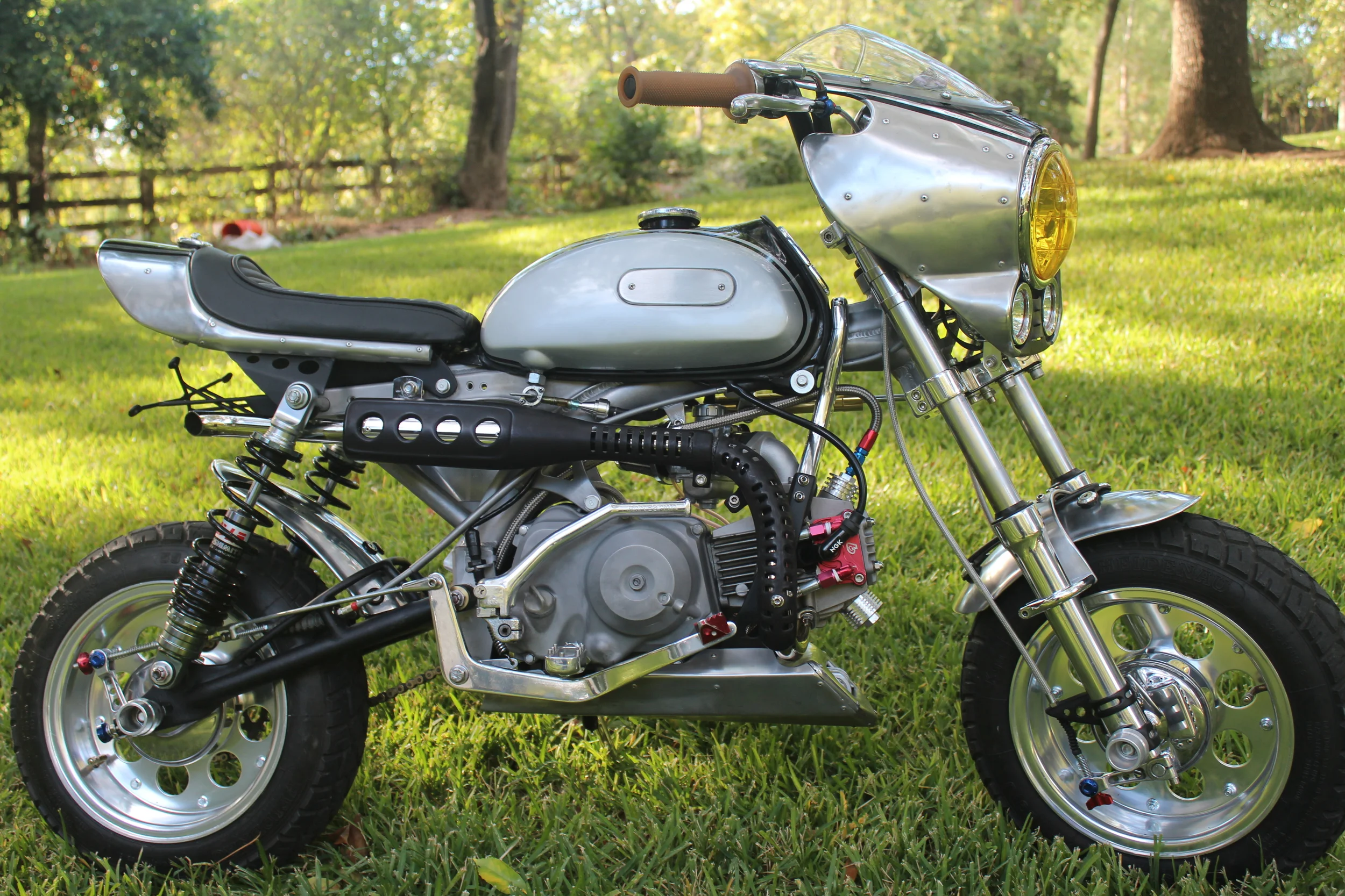  The exhaust is a Minigunz unit with a custom guard made from Honda CT90 and CT70 pieces, and a lengthened stinger. BBR alloy brake pedal. 