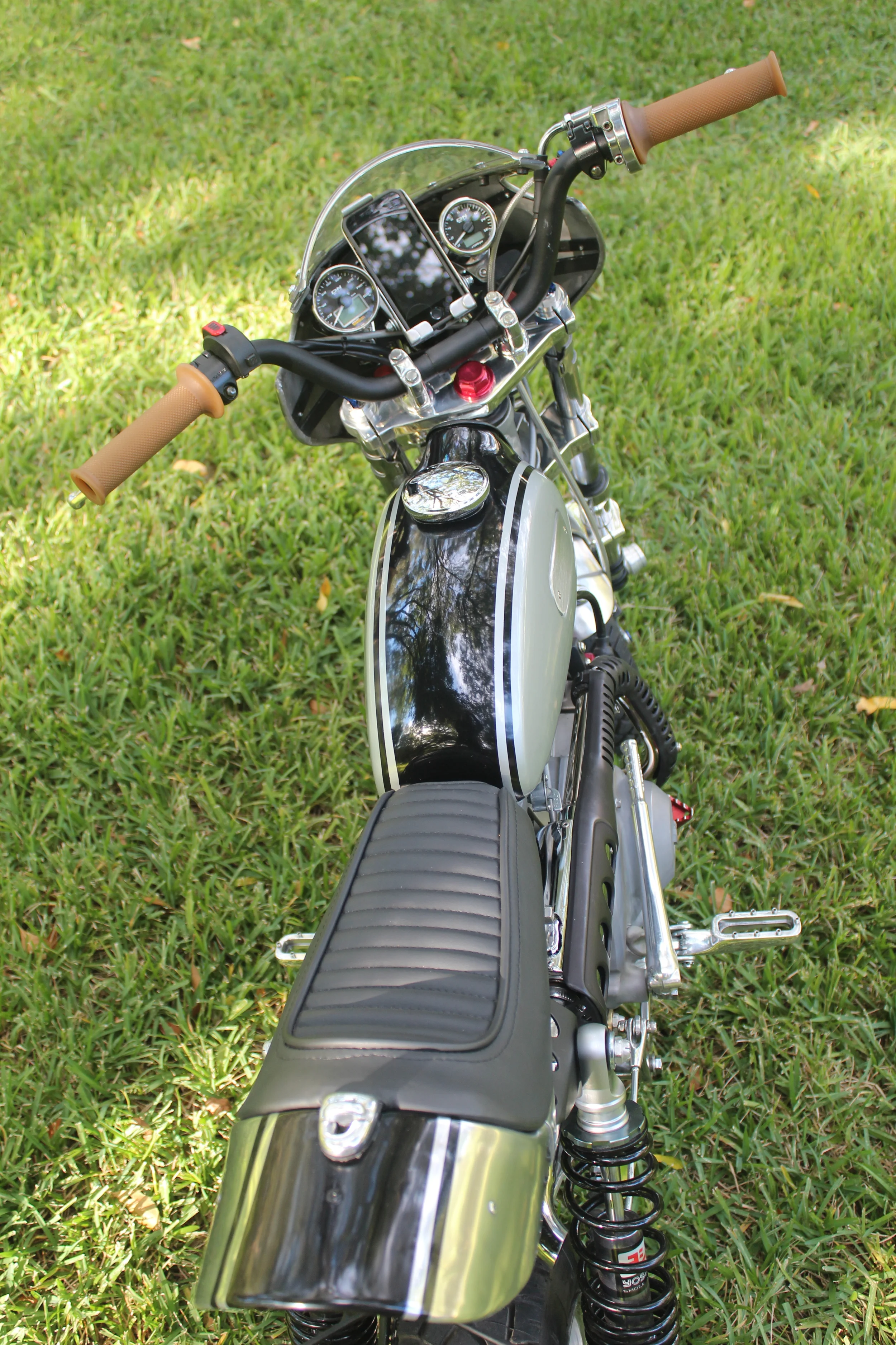The latch at the rear of the seat allows it to flip up, with storage underneath.