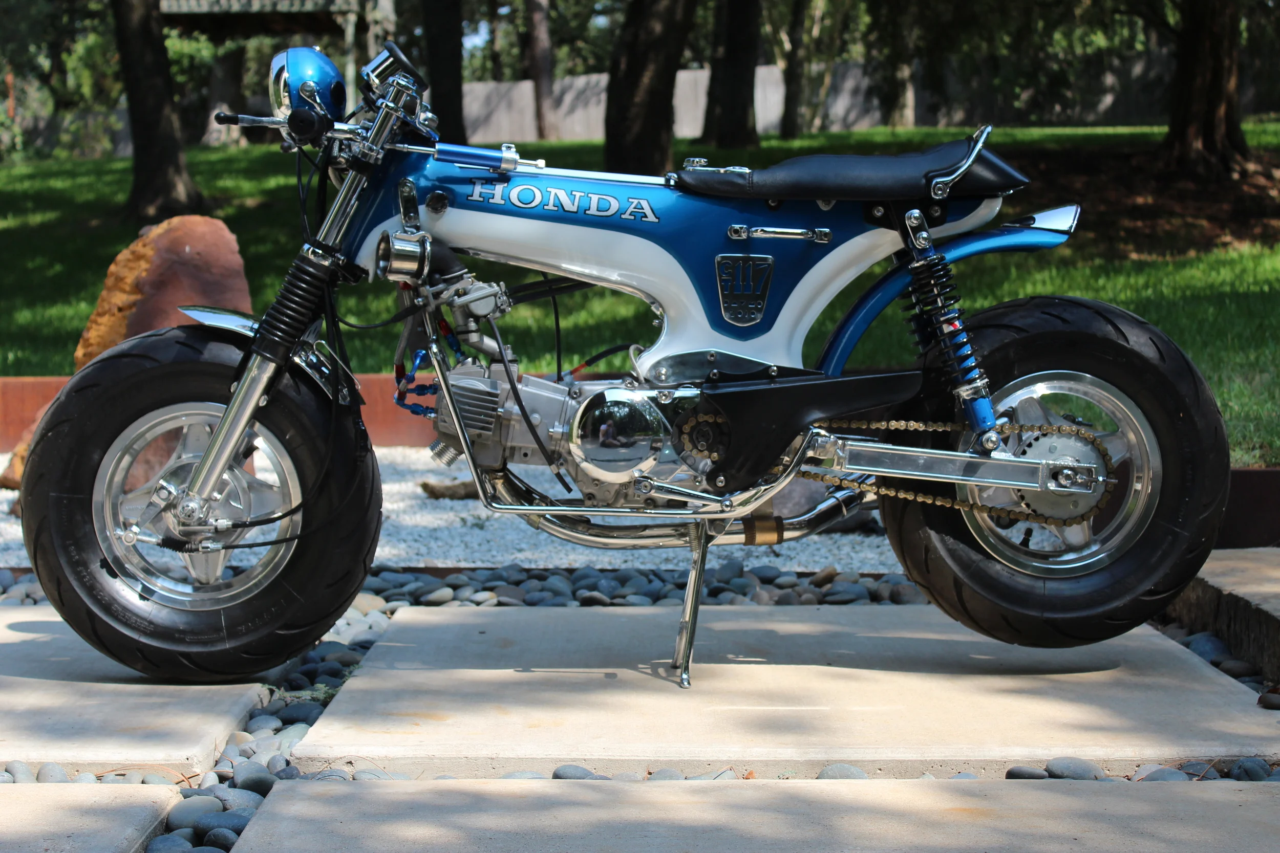  Kitaco extended swingarm. Front fender is from a Rupp mini, rear is from a Honda SL70 with a custom tail light. 