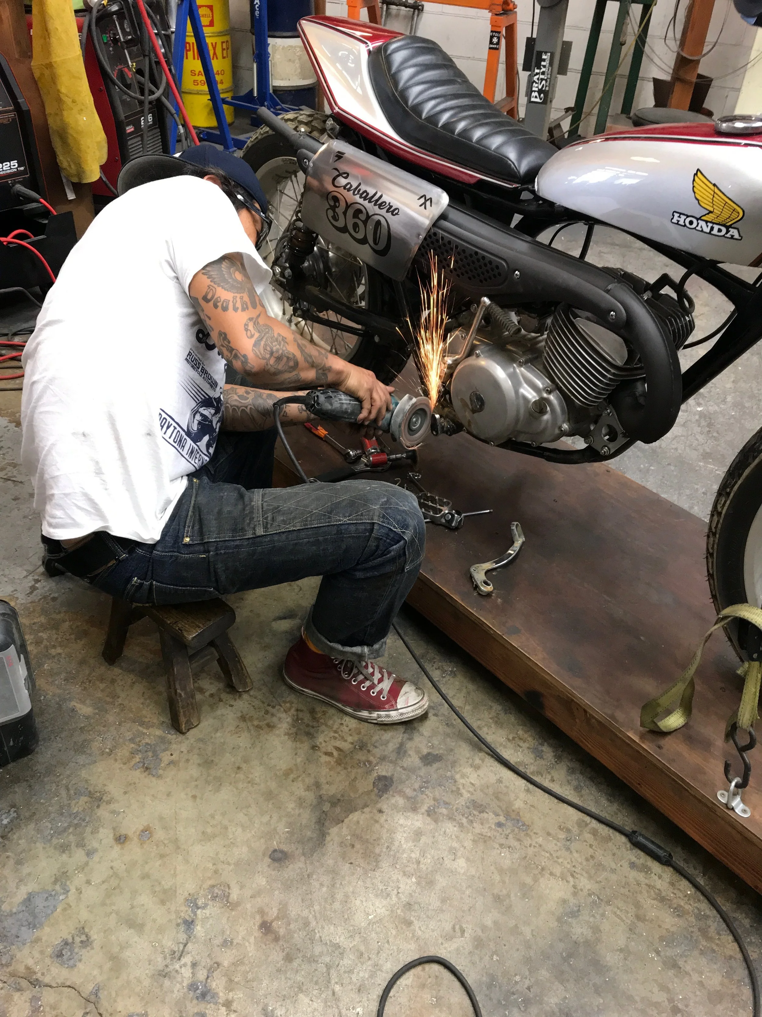  Go Takamine putting a footpeg back on the BrotherBike. 