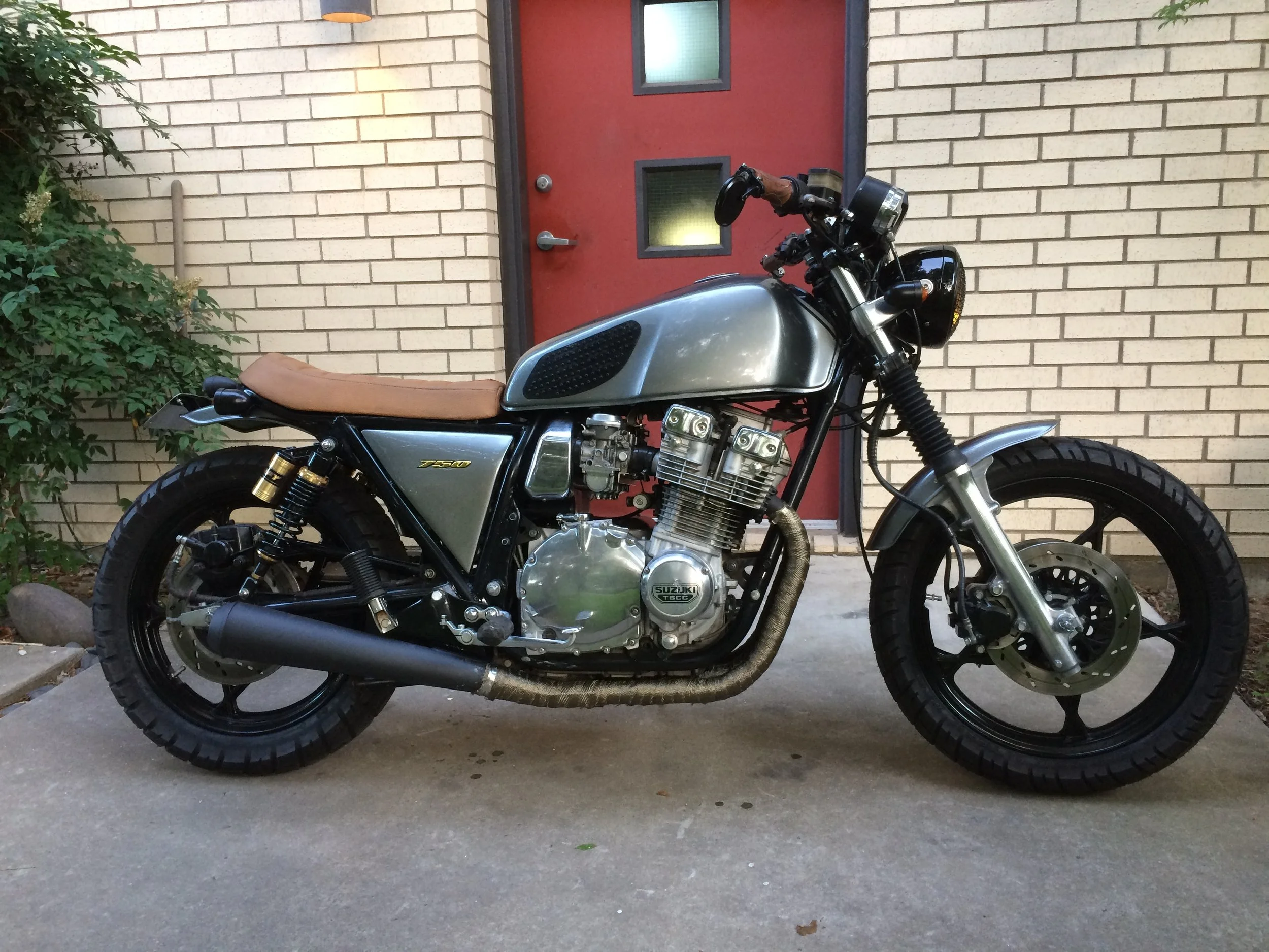  A 1980 Suzuki GS750, and a 1978 Suzuki GS550 with a 750 engine belonging to Brothers Justin and Austin Nall. Both wanted more compact seats, updated controls, handlebars, instruments, exhaust,  bodywork and paint. 