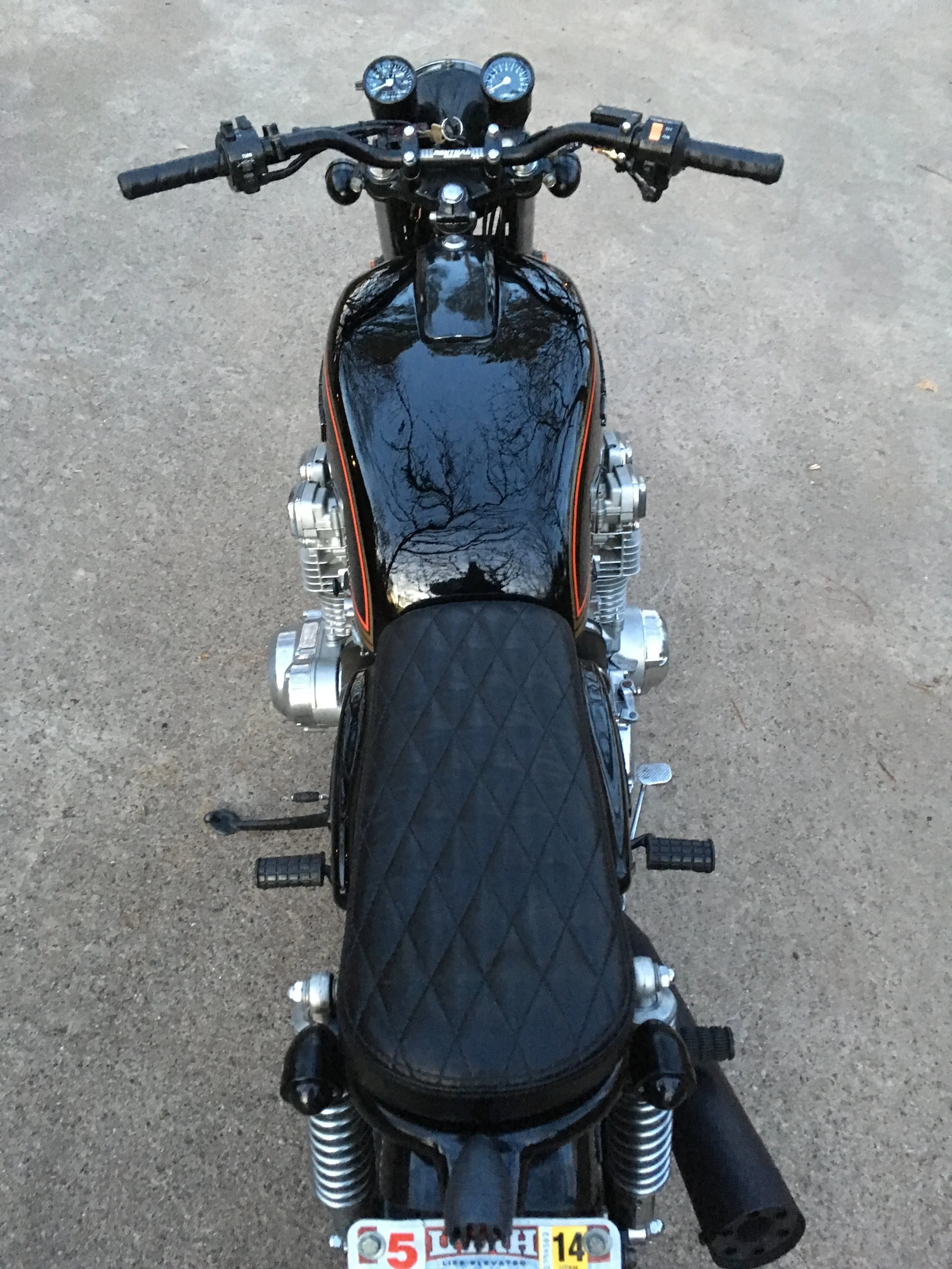   New smaller gauges, front brake master, Renthal bars, and Horween leather grips were applied. 