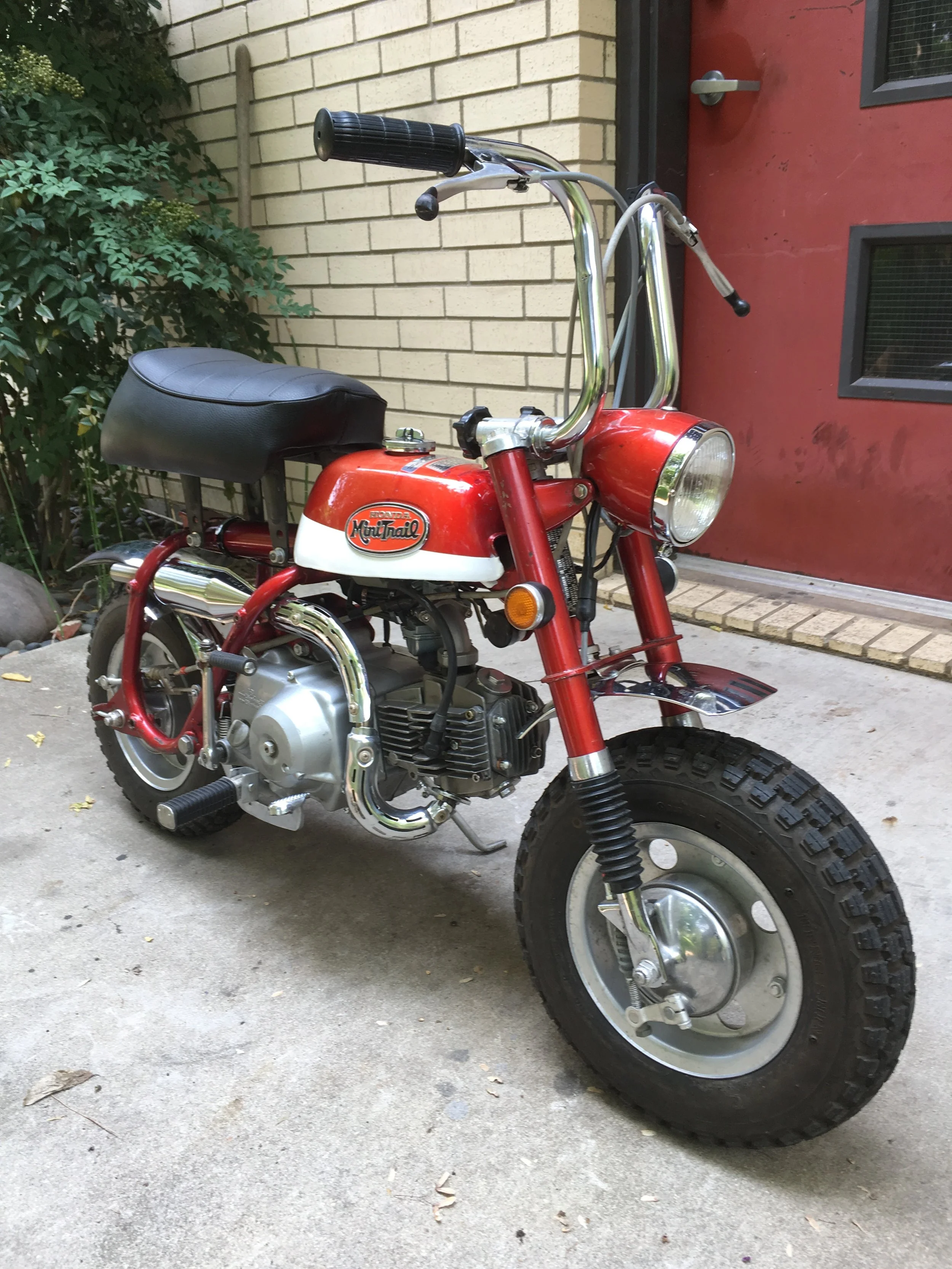  The lower white portion of the tank was re-painted, but the red is all original, as is the chrome. The wheels and brakes were completely rebuilt, forks were serviced and new boots put on. All hardware including the footpegs was replaced with freshly