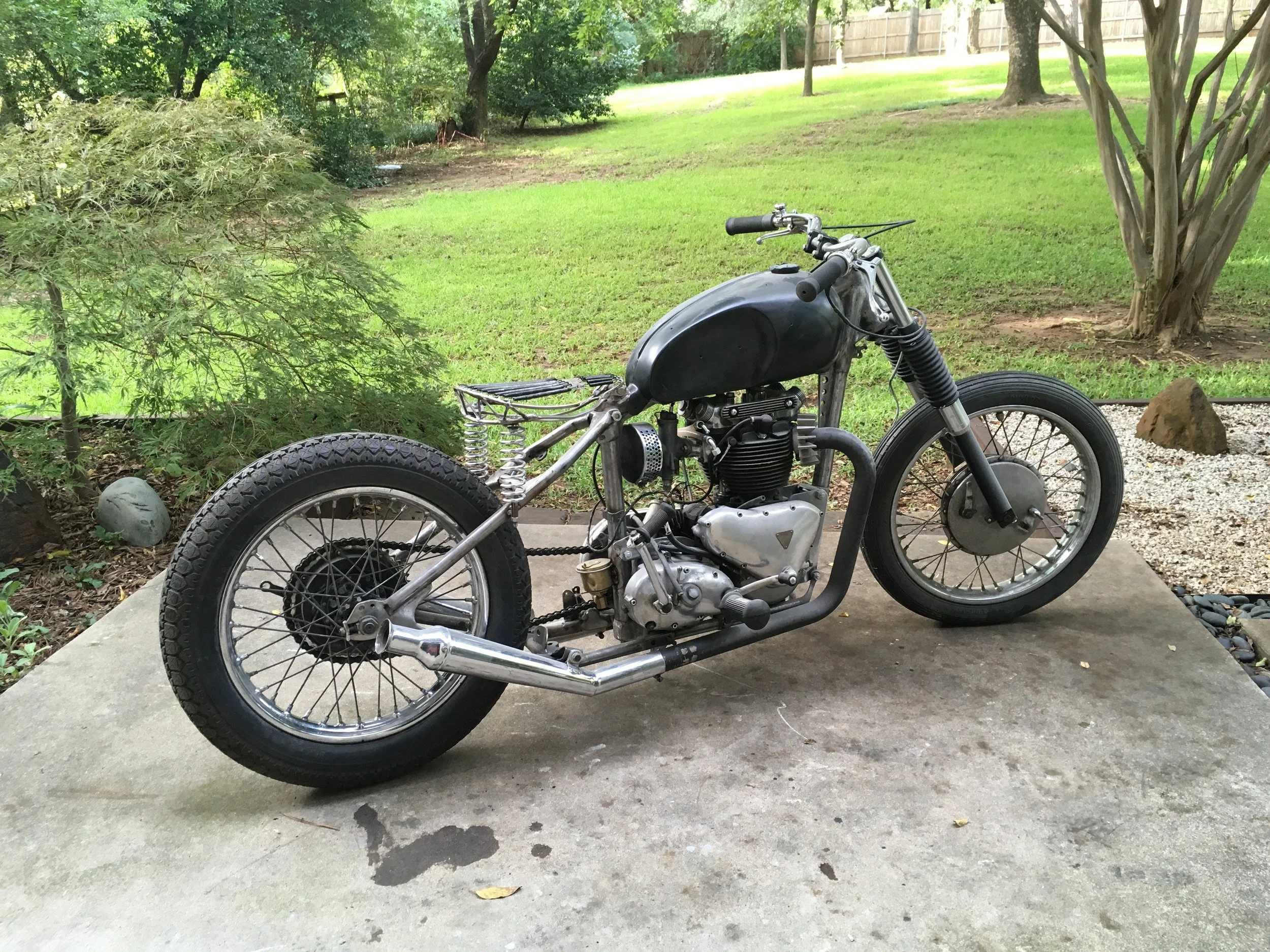  Looks pretty mean without the fenders. When the bike came to the shop, the rear frame was welded on. It was cut off, shortened a couple inches on the bottom, and bolt-on mounts were fabricated so the rear frame is removable like on the early ‘50’s T