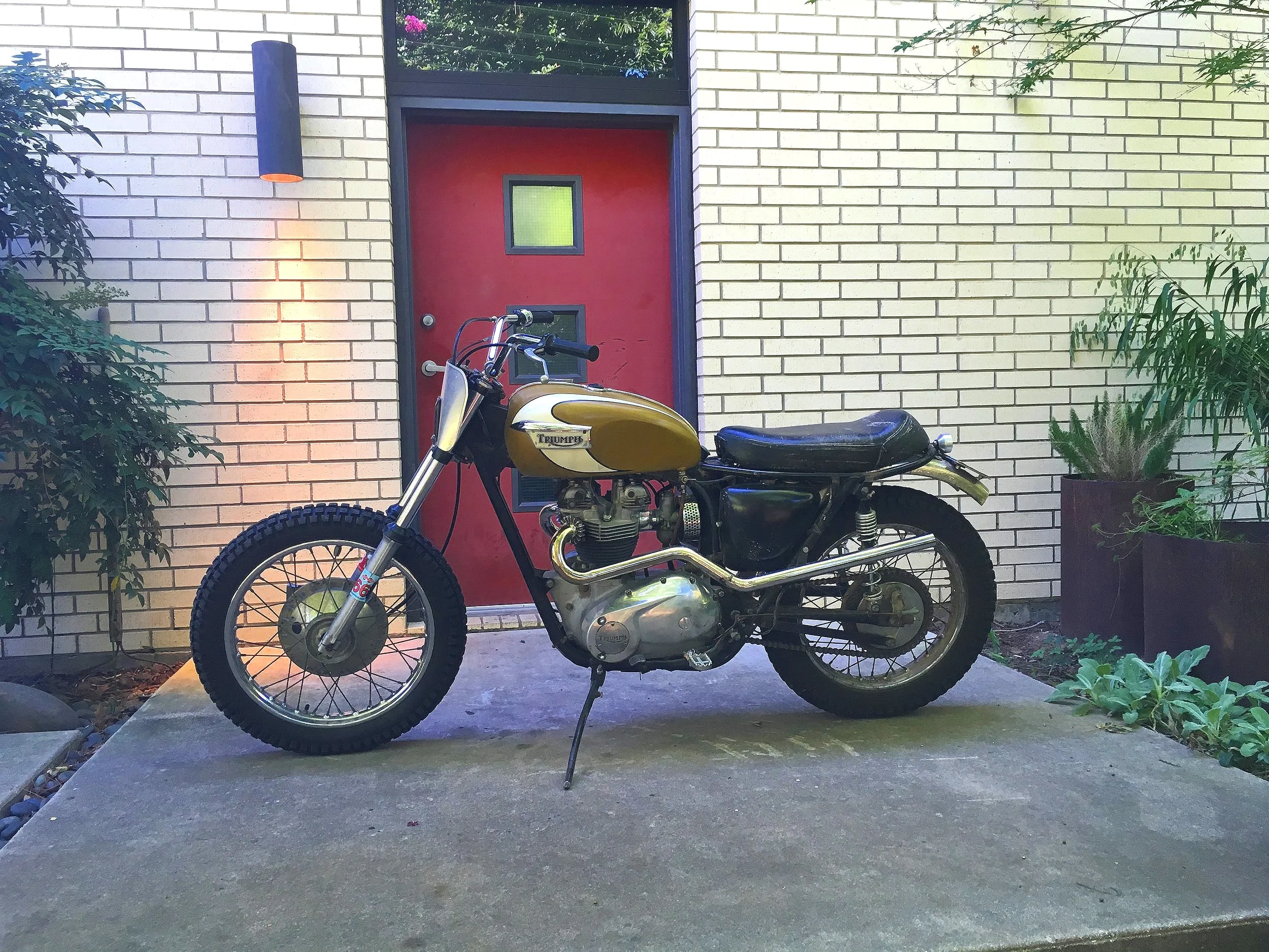 Jason Lee’s 1971 Triumph TR6C desert sled, “Goldie”came to the shop with no spark. A rapid battery discharge indicated there was a parasitic drain. The tail light would come on randomly when the bike was parked, and no amount of adjustment to the br…